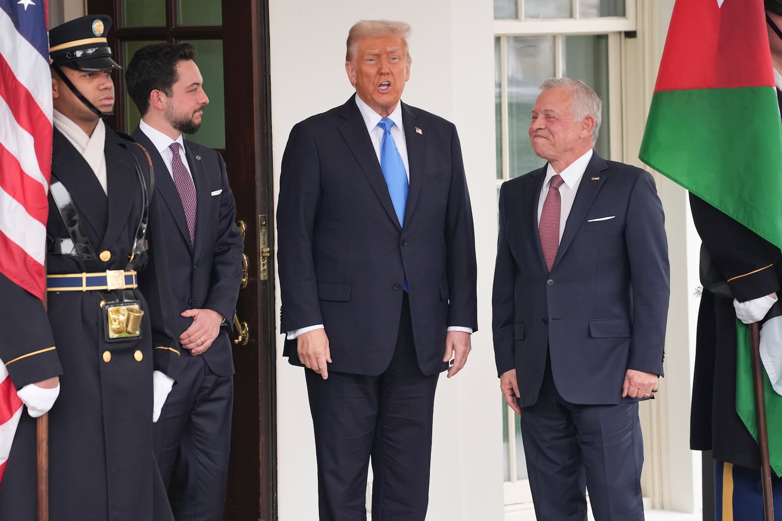 President Donald Trump greets Jordan's King Abdullah II, right, and Crown Prince Hussein at the White House, Tuesday, Feb. 11, 2025, in Washington. (AP Photo/Evan Vucci)