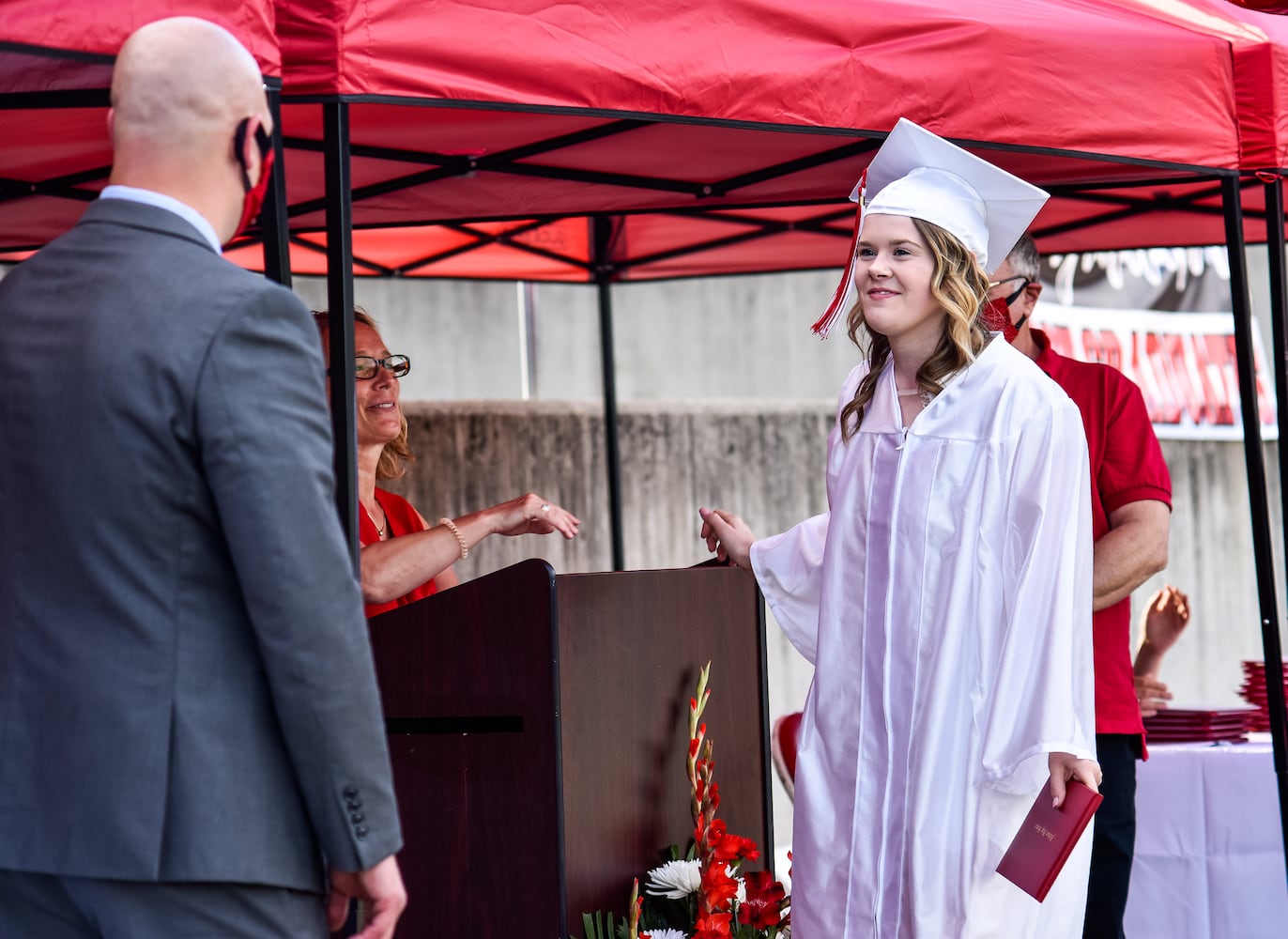 Madison High School drive-thru graduation ceremony at Land of Illusion