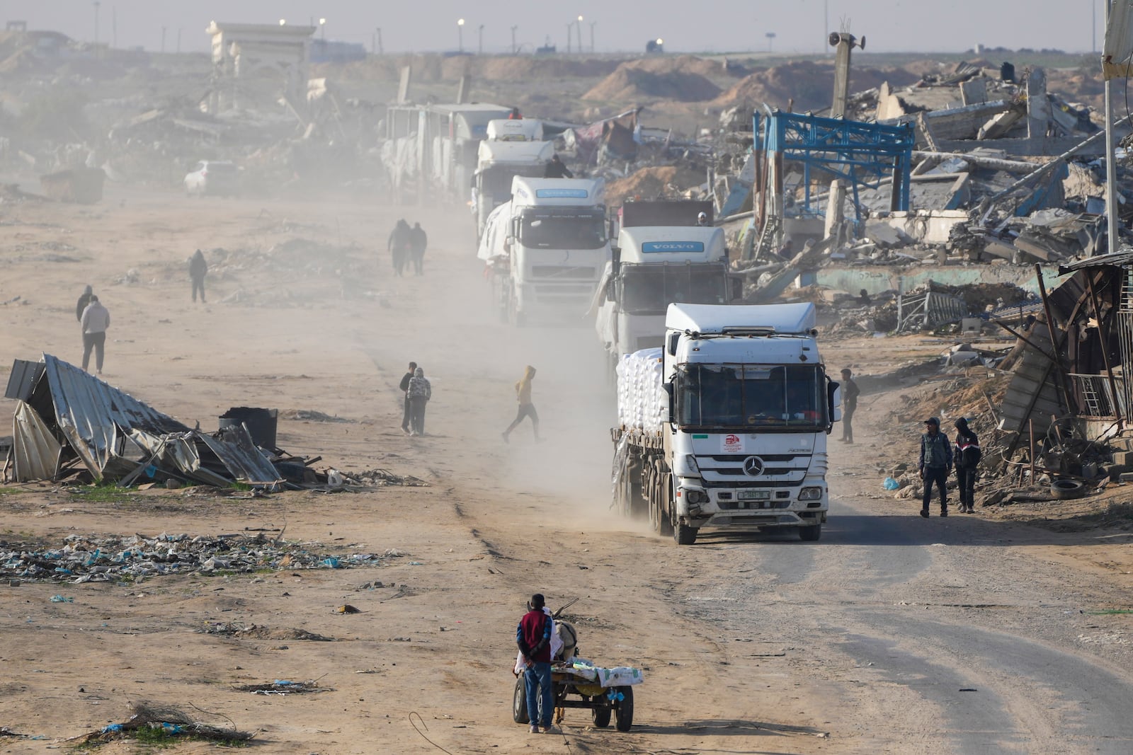 Trucks carrying humanitarian aid enter the Gaza Strip from Egypt in the southern Gaza town of Rafah, Wednesday, Feb. 12, 2025.(AP Photo/Abdel Kareem Hana)