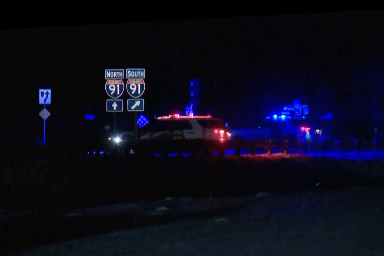 HOLD This image taken from video provided by WCAX shows police cars closing off a road after a shooting involving a U.S. Border Patrol agent on Interstate 91 near Coventry, Vt., Monday, Jan. 20, 2025. (WCAX via AP)