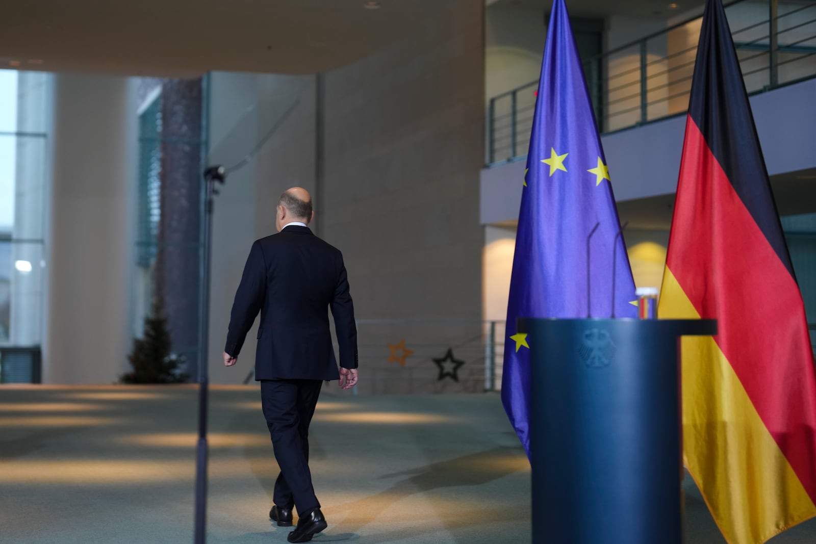 German Chancellor Olaf Scholz leaves after a statement after formally asking for a vote of confidence in parliament, to set the path for an early election in spring 2025, at the chancellery in Berlin, Germany, Wednesday, Dec. 11, 2024. (AP Photo/Markus Schreiber)