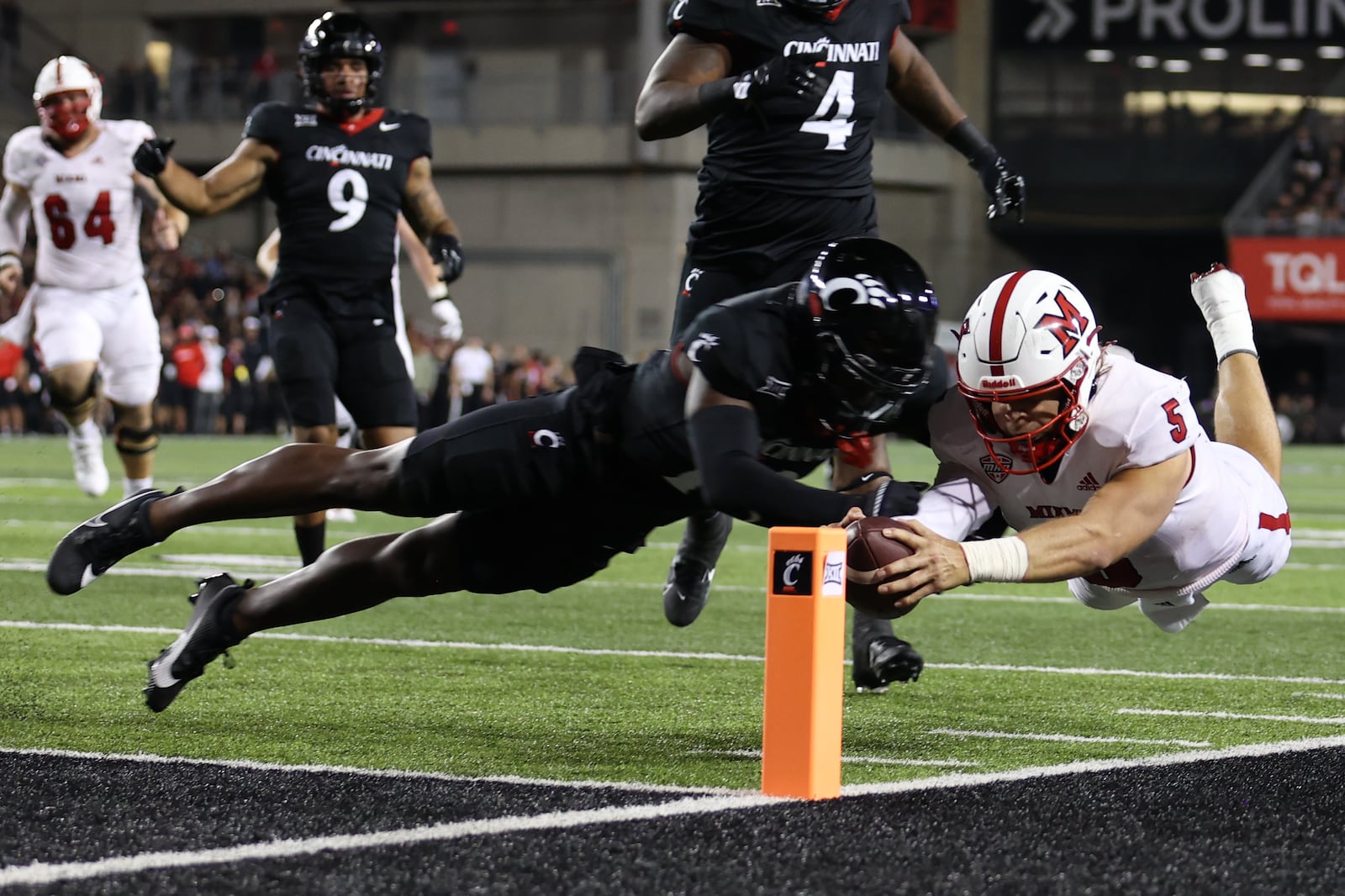 Miami quarterback Brett Gabbert dives for the pylon against Cincinnati at Nippert Stadium on Sept. 16, 2023. Miami University Athletics Photo