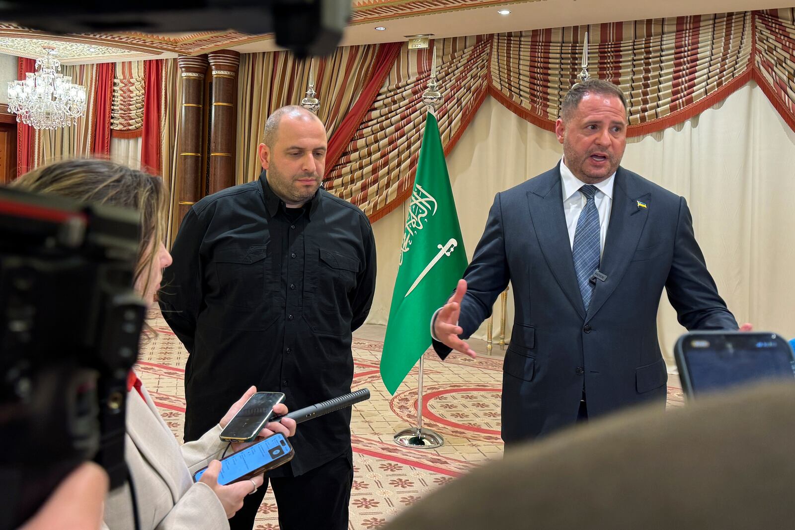 Ukrainian Head of Presidential Office Andriy Yermak, right, and Ukrainian Minister of Defense Rustem Umerov speak to journalists in Jeddah, Saudi Arabia, Tuesday, March 11, 2025. (AP Photo/Baraa Anwer)