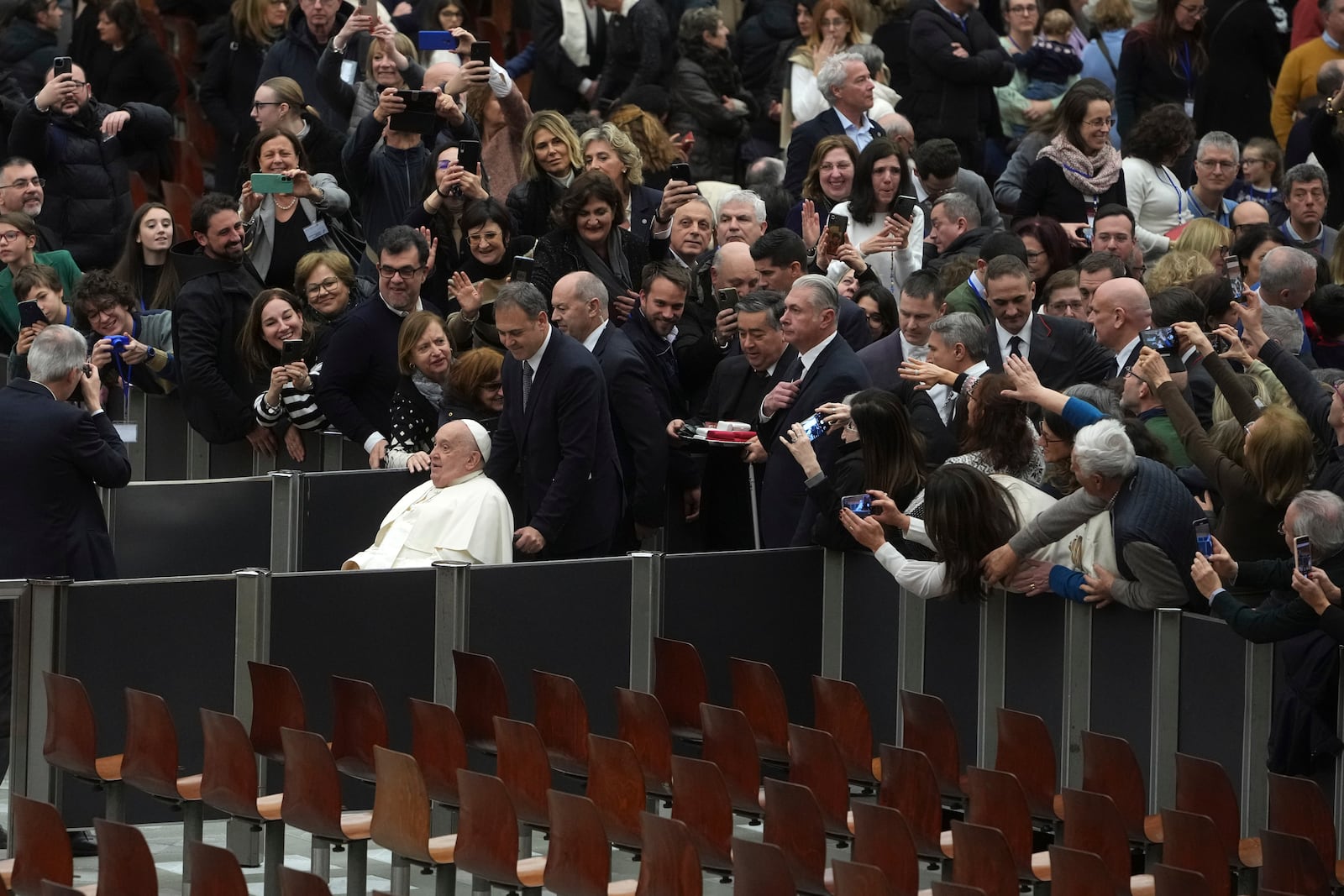 Pope Francis leaves after an audience with Catholic associations of teachers and students' parents in the Paul VI Hall, at the Vatican, Saturday, Jan. 4, 2025. (AP Photo/Alessandra Tarantino)