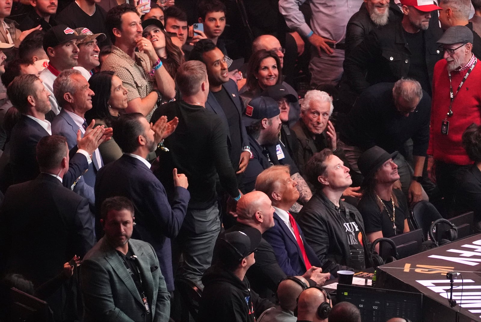 Dana White, President-elect Donald Trump, Elon Musk and Kid Rock watch as Brazil's Mauricio Ruffy celebrates his win over Peru's James Llontop at UFC 309 at Madison Square Garden, Saturday, Nov. 16, 2024, in New York. (AP Photo/Evan Vucci)