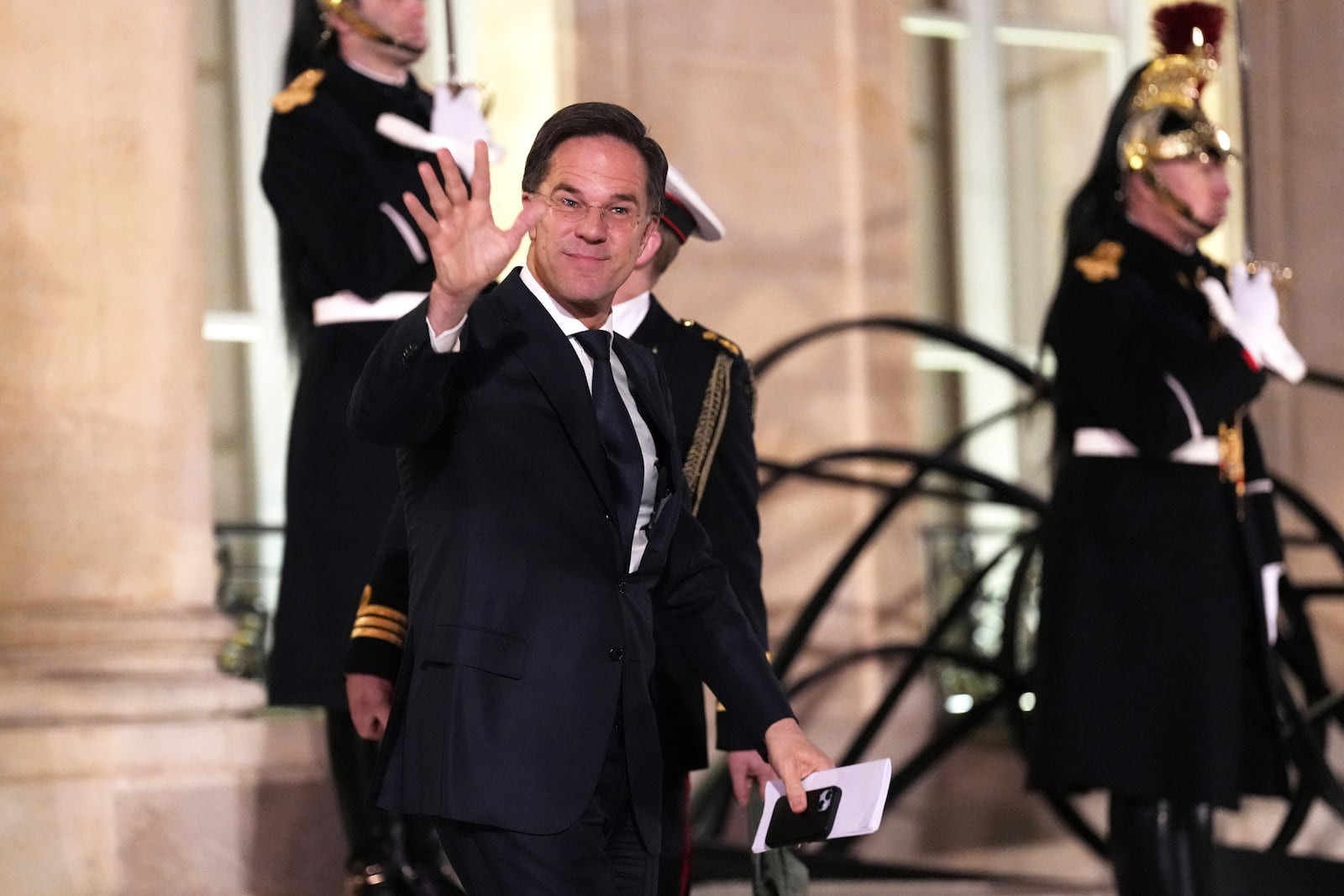 NATO Secretary General Mark Rutte waves as he leaves the Elysee Palace, after an informal meeting of leaders from key European Union nations and the United Kingdom, in Paris, Monday, Feb. 17, 2025. (AP Photo/Aurelien Morissard)