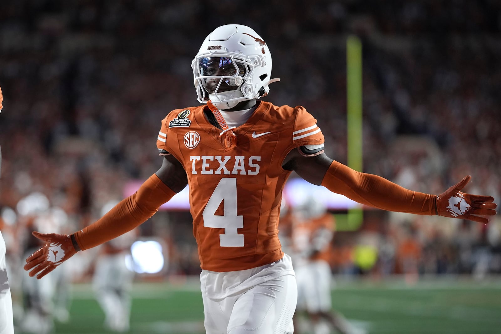 Texas defensive back Andrew Mukuba celebrates a defensive stop during the second half against Clemson in the first round of the College Football Playoff, Saturday, Dec. 21, 2024, in Austin, Texas. (AP Photo/Eric Gay)