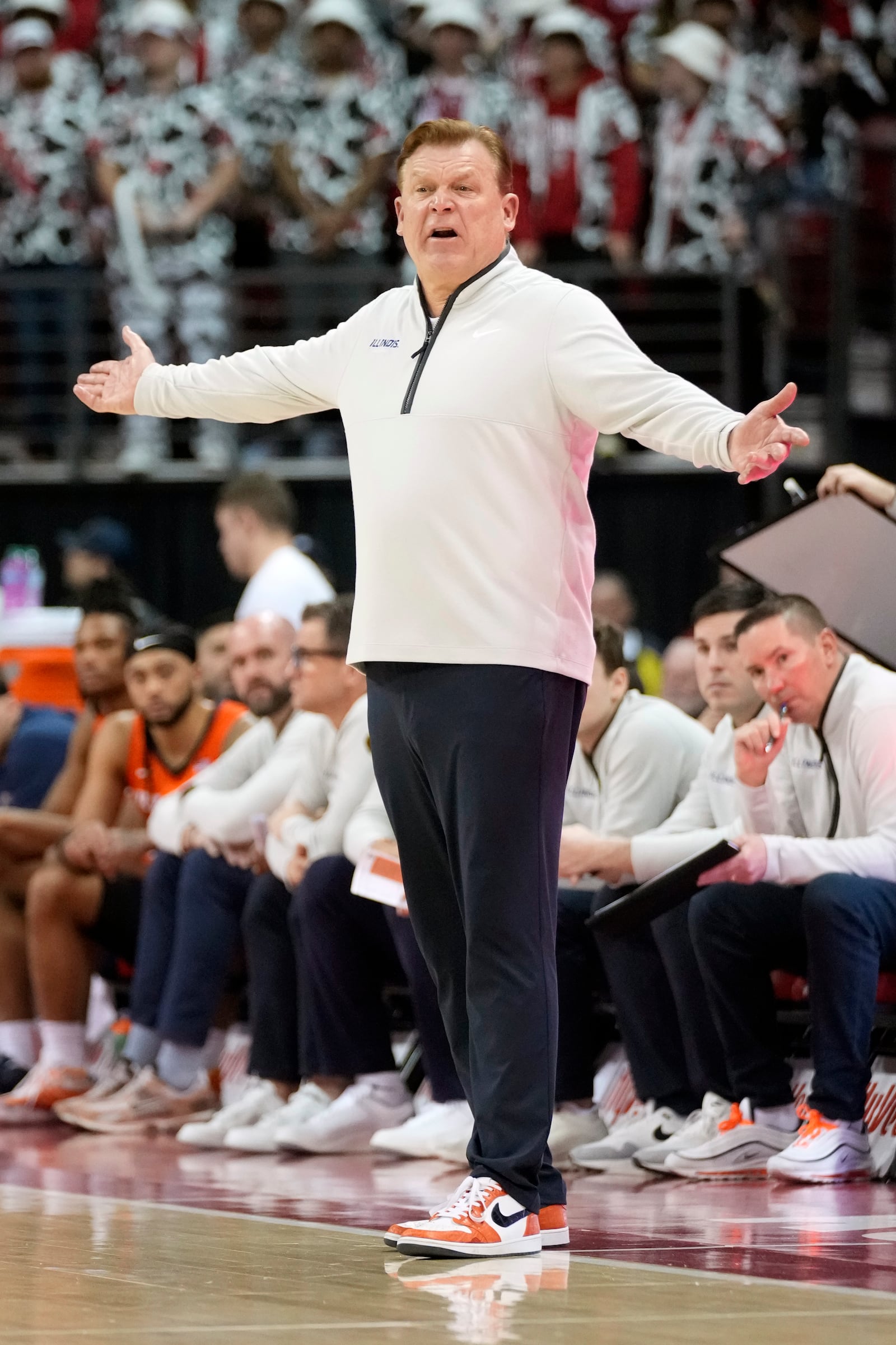 Illinois head coach Brad Underwood reacts to a foul call during the second half of an NCAA college basketball game against Wisconsin, Tuesday, Feb. 18, 2025, in Madison, Wis. (AP Photo/Kayla Wolf)