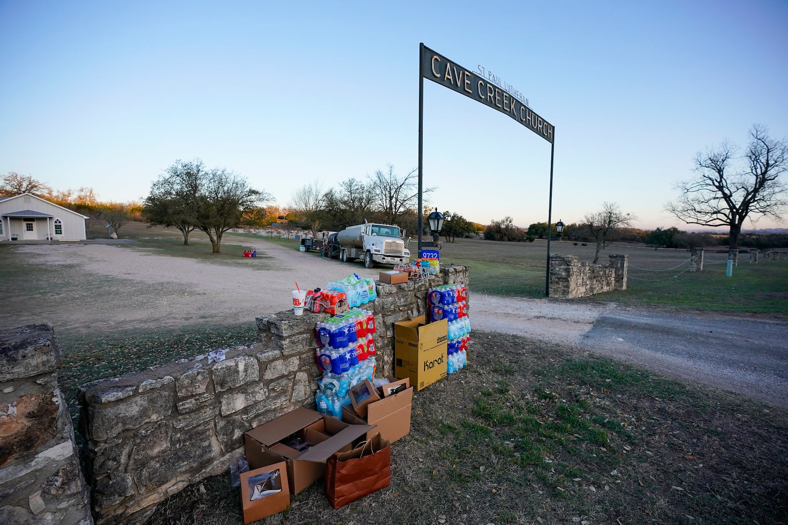 Supplies are set up in front of Gillespie County's St. Paul's Lutheran Cave Creek Church for first responders of the Crabapple Fire, Sunday, March 16, 2025. (Robin Jerstad/The San Antonio Express-News via AP)