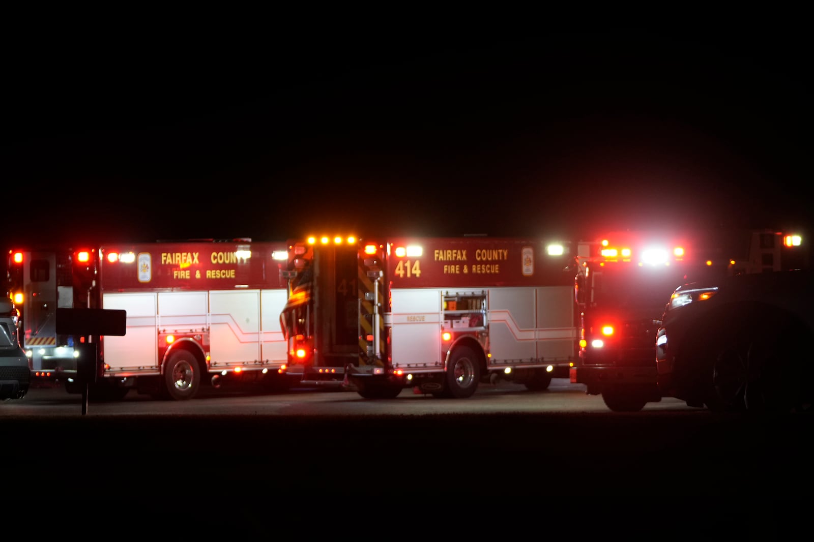 Emergency equipment stages at Gravelly Point, north of Ronald Reagan Washington National Airport, along the Potomac River, Wednesday, Jan. 29, 2025, in Arlington, Va. (AP Photo/Mark Schiefelbein)