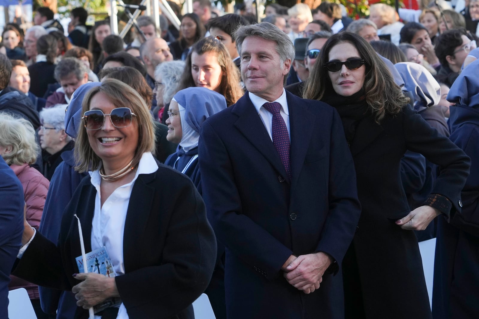 Emanuele Filiberto of Savoy, second from right, attends a mass presided by Pope Francis in Ajaccio "Place d'Austerlitz" during his visit in the French island of Corsica, Sunday, Dec. 15, 2024. (AP Photo/Alessandra Tarantino)