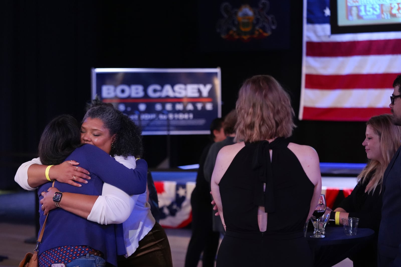 Supporters hug goodbye as they prepare to leave an election night watch party for Sen. Bob Casey, D-Pa., Tuesday Nov. 5, 2024, in Scranton, Pa. (AP Photo/Chris Szagola)