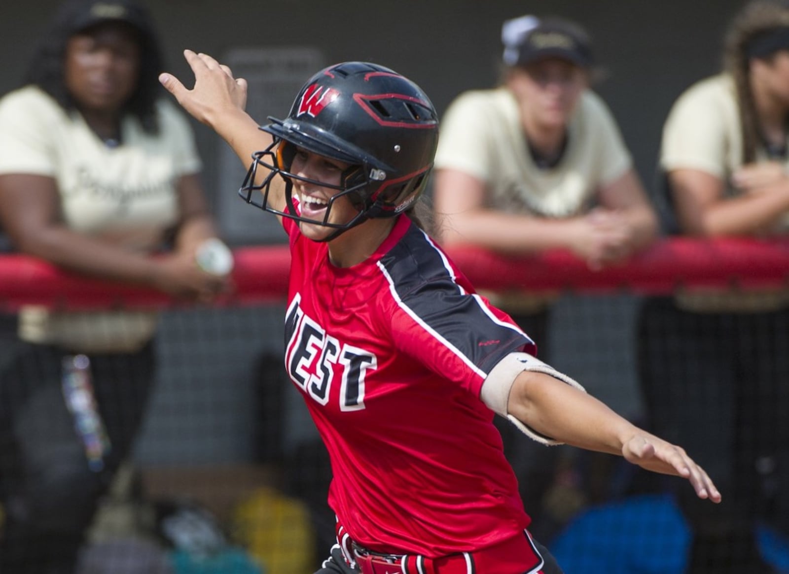 Lakota West’s Allie Cummins rounds third base after her eighth-inning home run in a Division I state semifinal against Perrysburg at Firestone Park in Akron on May 31. PHIL LONG/OHIO PRESS PHOTO SYSTEM