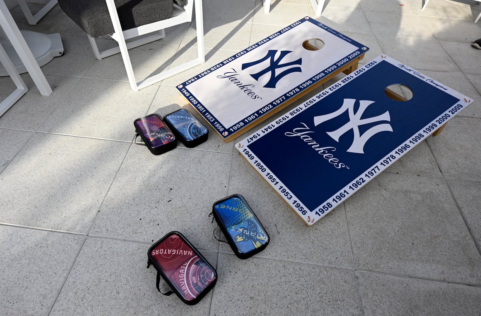 Corn hole boards sit on a patio outside the New York Yankees clubhouse kitchen during a tour of the upgraded team spring training facilities Thursday, Feb. 13, 2025, at George M. Steinbrenner Field in Tampa, Fla. (AP Photo/Steve Nesius)