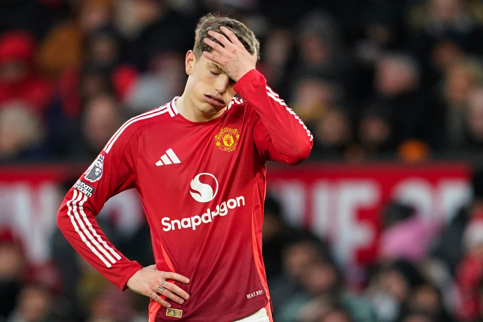 Manchester United's Alejandro Garnacho is dejected after missing an opportunity to score during the English Premier League soccer match between Manchester United and Bournemouth at the Old Trafford stadium in Manchester, England, Sunday, Dec. 22, 2024. (AP Photo/Dave Thompson)