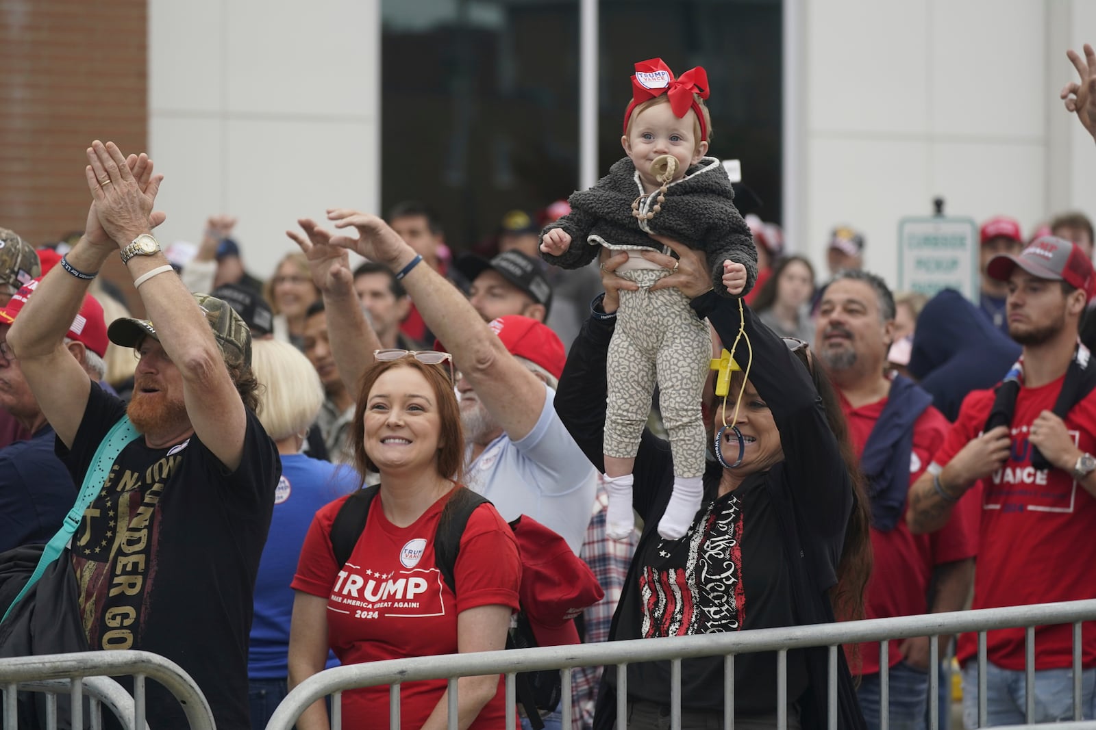 Supporters arrive for a rally for Republican presidential nominee former President Donald Trump in Rocky Mount, N.C., Wednesday, Oct. 30, 2024. (AP Photo/Steve Helber)