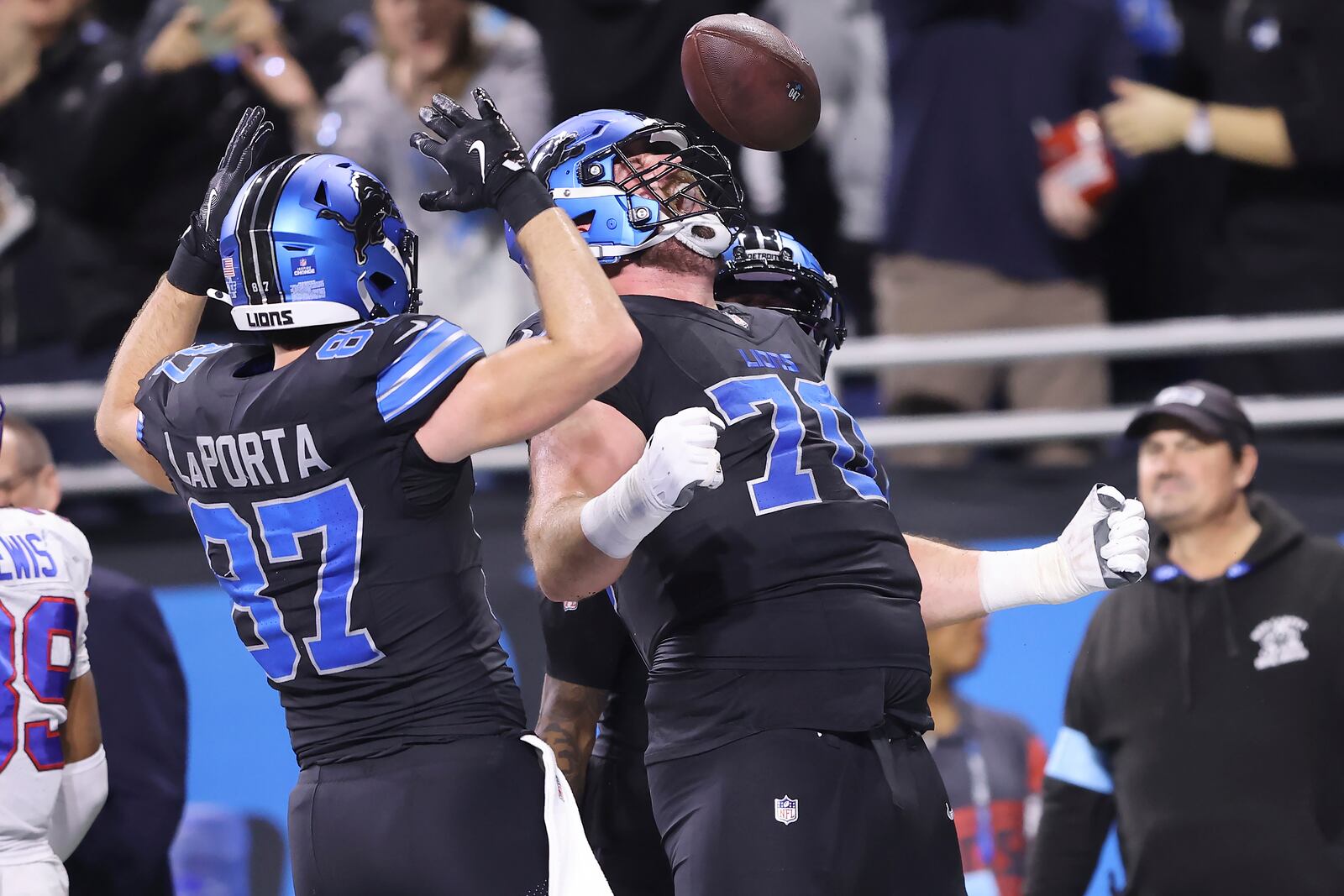 Detroit Lions offensive tackle Dan Skipper, right, celebrates with tight end Sam LaPorta (87) after scoring against the Buffalo Bills during the first half of an NFL football game, Sunday, Dec. 15, 2024, in Detroit. (AP Photo/Rey Del Rio)