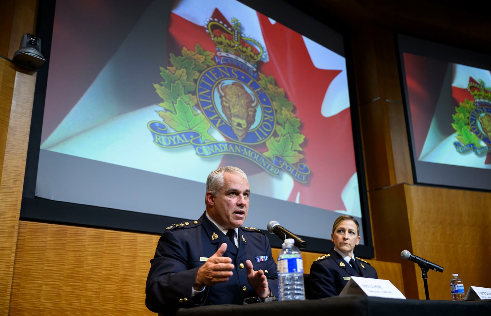 RCMP Commissioner Mike Duheme, left, and Assistant Commissioner Brigitte Gauvin participate in a news conference at RCMP National Headquarters in Ottawa, Ontaio, Monday, Oct. 14, 2024. (Justin Tang/The Canadian Press via AP)