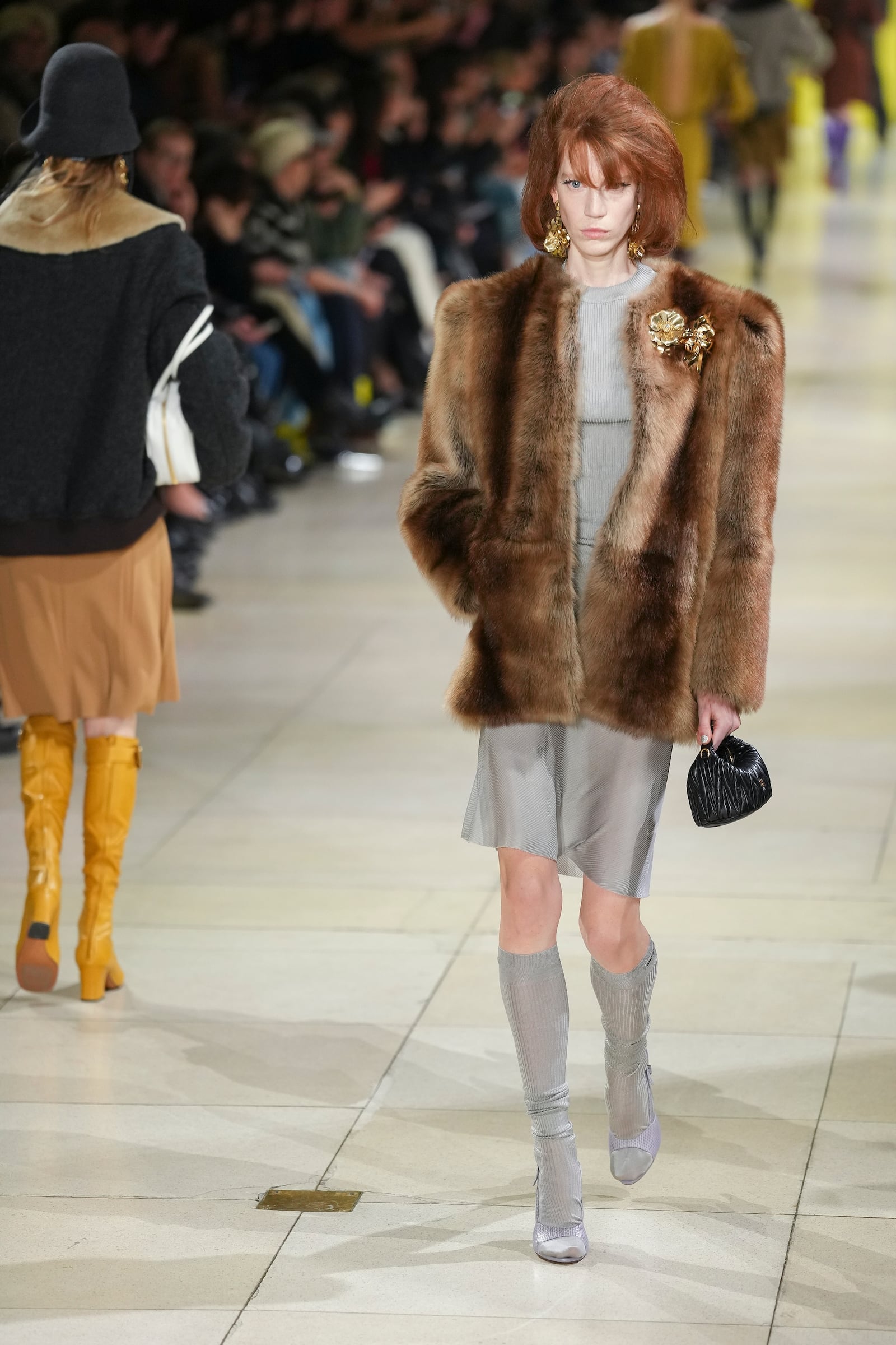 A model wears a creation as part of the Miu Miu Fall/Winter 2025-2026 Womenswear collection presented Tuesday, March 11, 2025. in Paris. (Photo by Scott A Garfitt/Invision/AP)