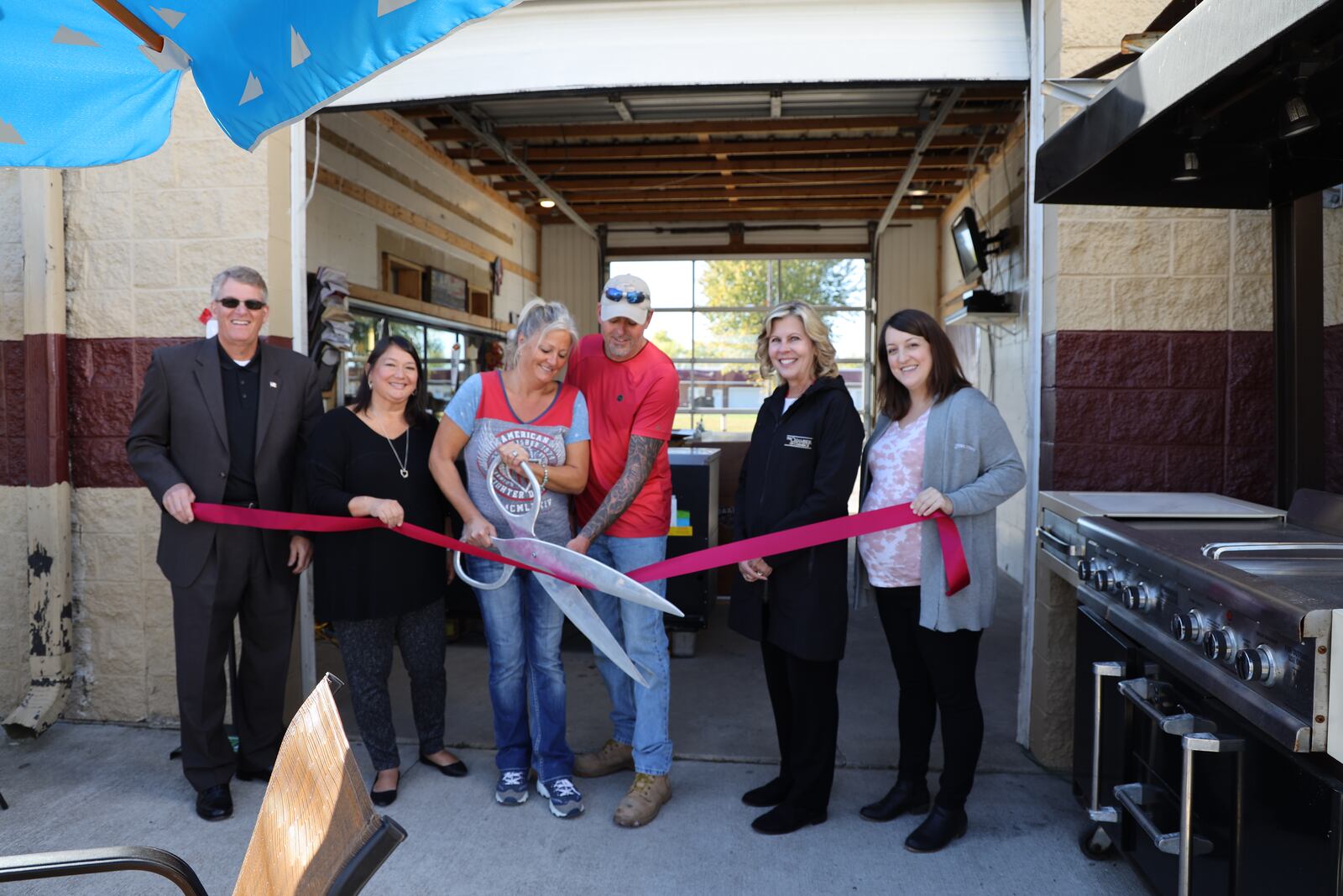 Karen and Rob Richardson, center, have a ribbon cutting ceremony Oct. 1 of their new business, BAABs Kayaking and Livery, a kayaking base and a bar and bistro. They are flanked by representatives of the Middletown Economic Development Department and The Chamber of Commerce Serving Middletown, Monroe and Trenton. From left are Rick Pearce, Chamber CEO/president, Chris Xeil Lyons, city economic development director, Karen Richardson, Rob Richardson, Ann Banks, Chamber office manager, and Alaina Geres, city economic development program manager. CONTRIBUTED/CITY OF MIDDLETOWN