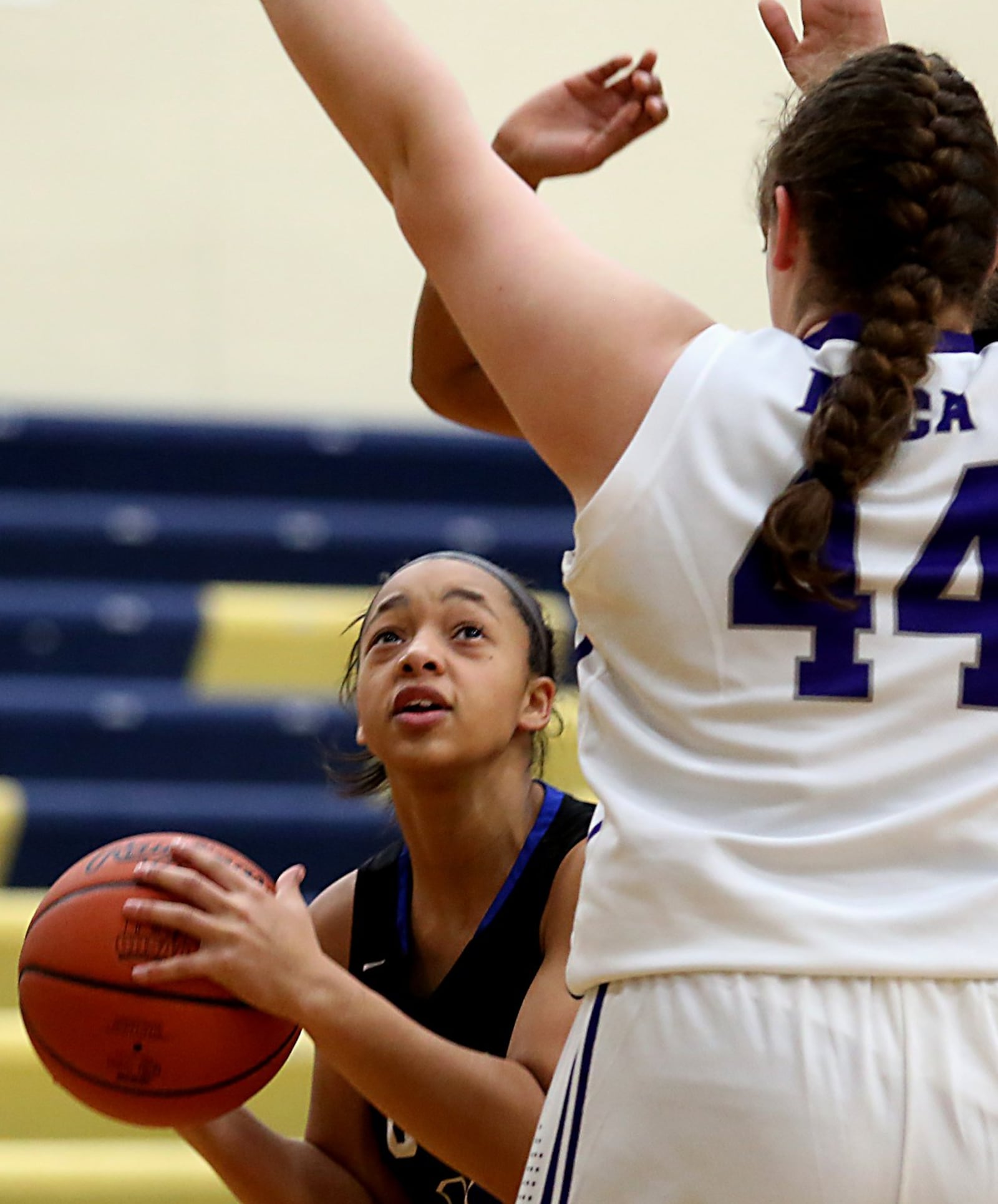 Cincinnati Christian guard Daja Thacker tries to get a look at the basket as Miami Valley Christian Academy center Dawsyn Vilardo defends Tuesday night during their Division IV sectional ame at Monroe. CONTRIBUTED PHOTO BY E.L. HUBBARD