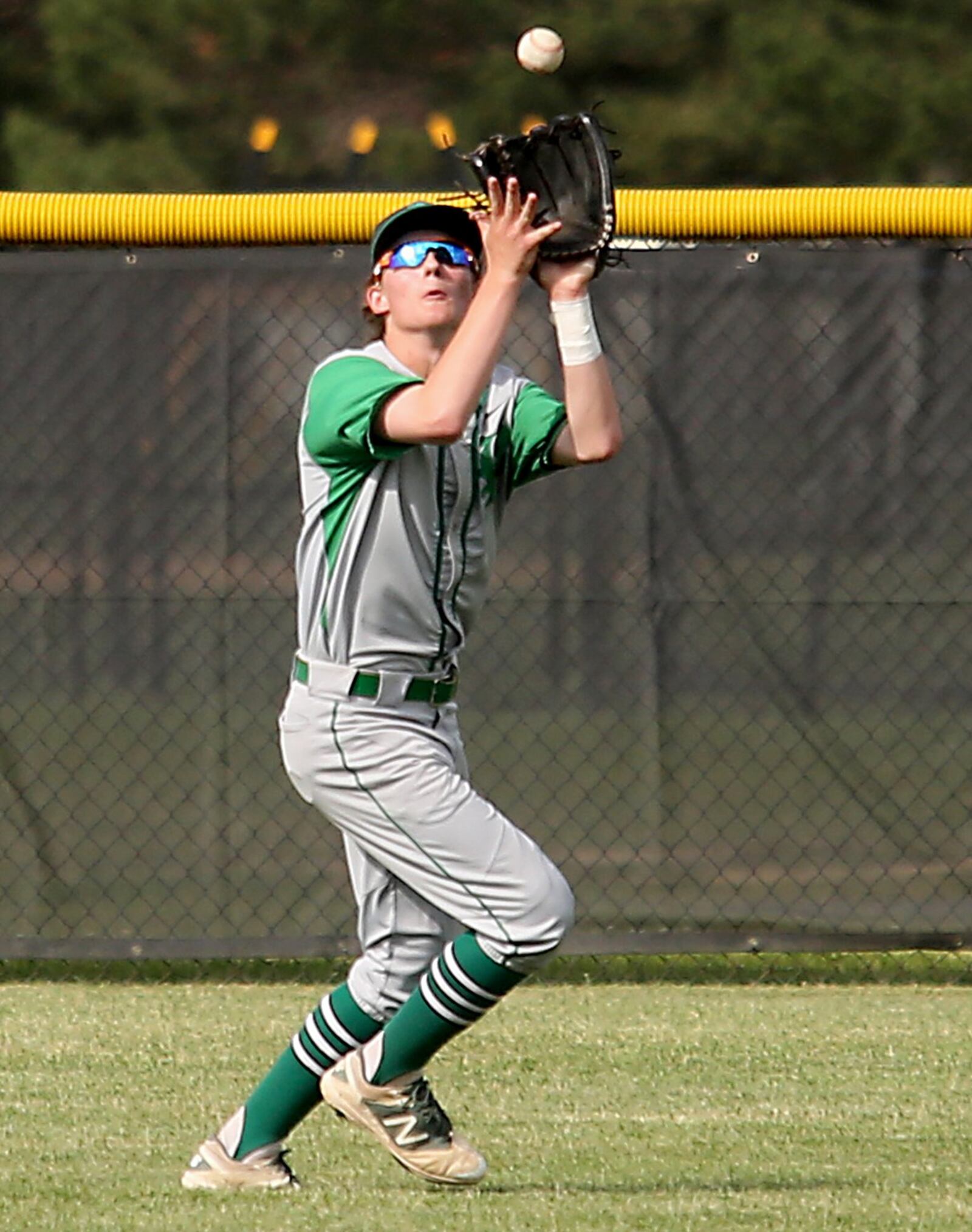 Badin center fielder Gavin Matthews makes a catch Thursday during a Division II sectional against Chaminade Julienne at Miamisburg. CONTRIBUTED PHOTO BY E.L. HUBBARD