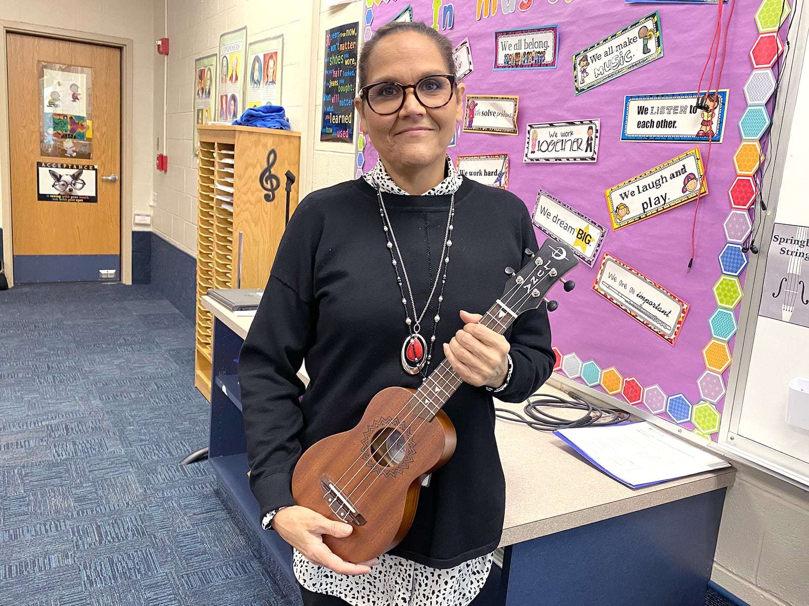 Larissa McIntosh, sixth grade choir and strings teacher at Springboro Intermediate School, organized a fundraiser to purchase ukuleles for her choir students to learn and play. CONTRIBUTED PHOTO / SCOTT MARSHALL