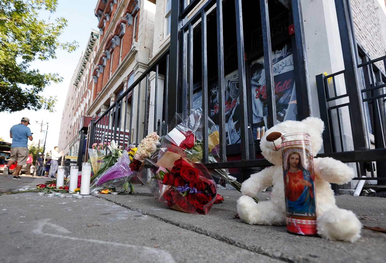 Memorials to the Dayton shooting victims and dozens of media workers filled the sidewalks of the Oregon District on Monday morning in the wake of ten people being killed, including the shooter, and more than two dozen injured at 1:00 A.M. on Sunday morning.  TY GREENLEES / STAFF