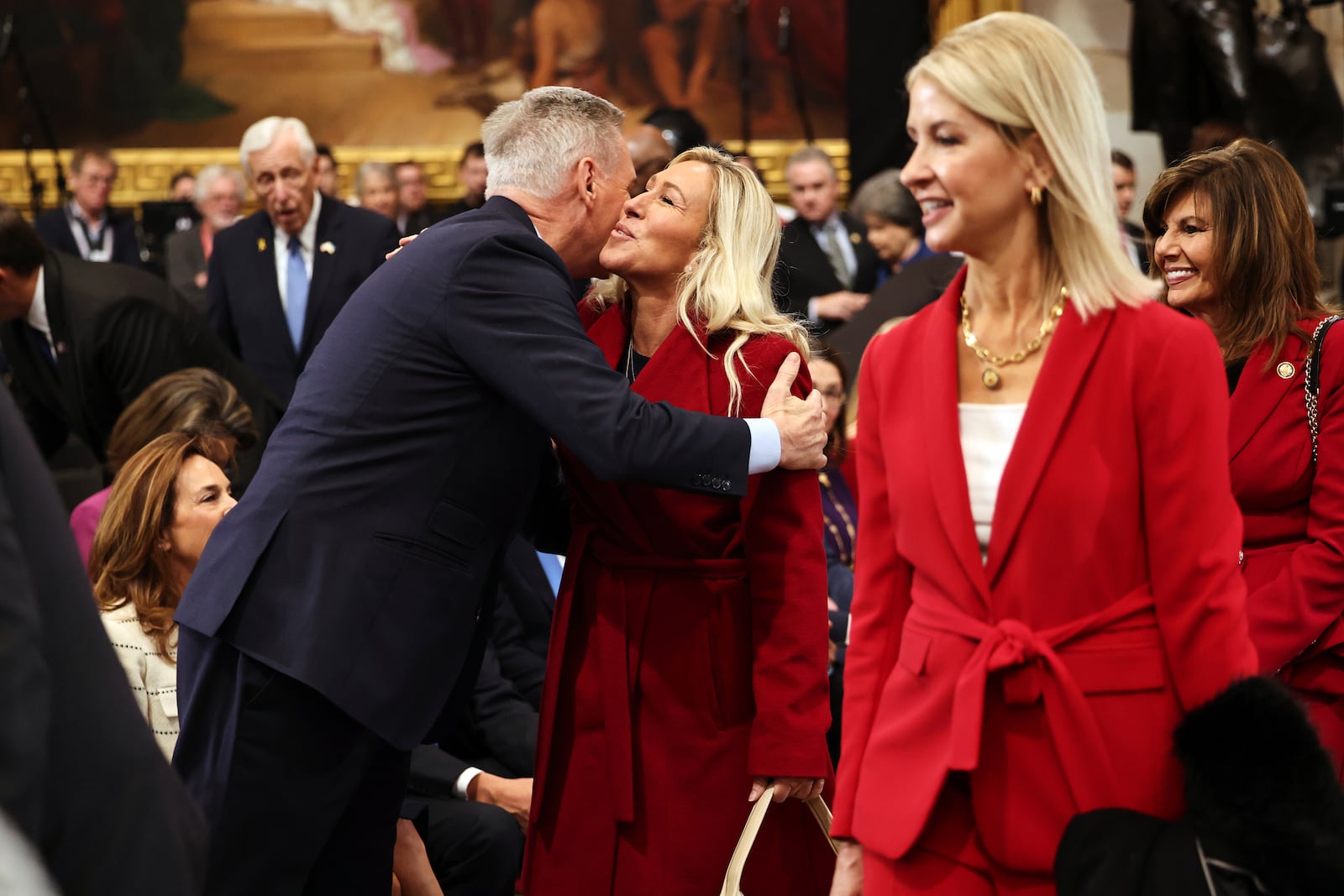 Former Speaker of the House Kevin McCarthy, left, greets Rep. Marjorie Taylor Greene, R-Ga., before the 60th Presidential Inauguration in the Rotunda of the U.S. Capitol in Washington, Monday, Jan. 20, 2025. (Chip Somodevilla/Pool Photo via AP)