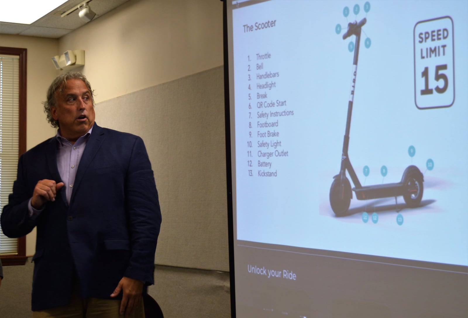 Jeremy Lynch, of Bird, speaks to an audience at the Sept. 21 meeting of the Student Community Relations Commission about the company s e-scooters they plan to bring to Oxford. 