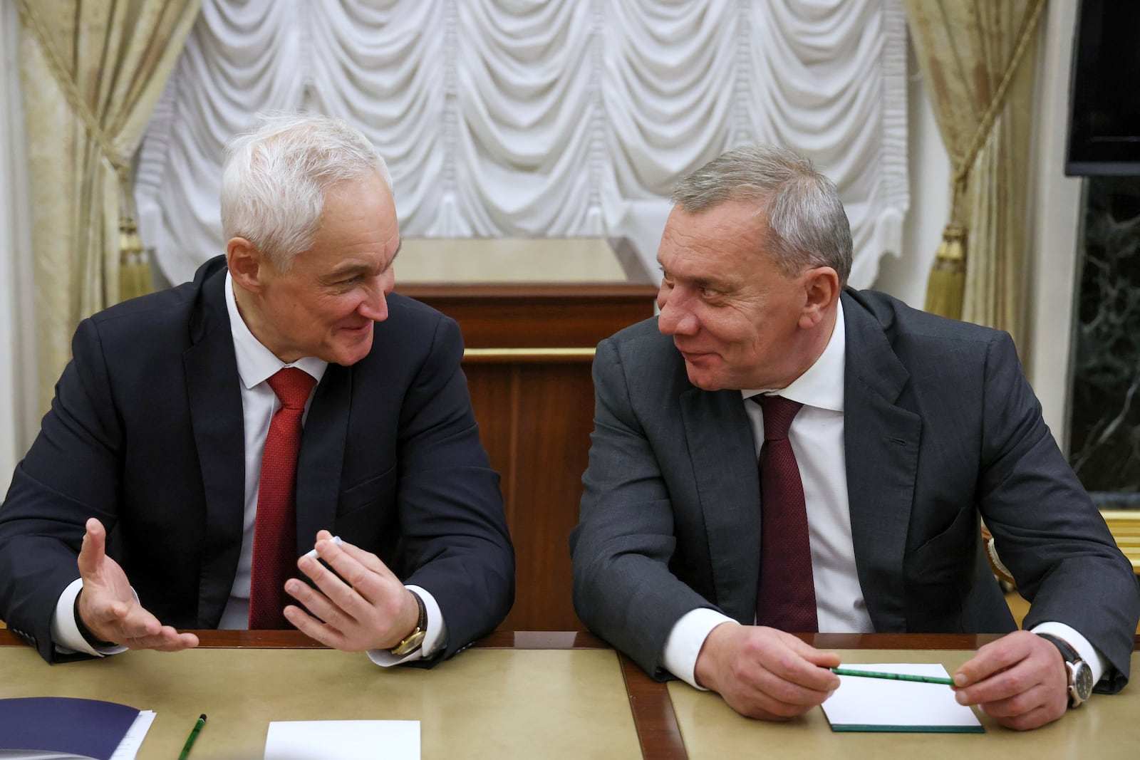 Russian Defense Minister Andrei Belousov, left, and the head of Russian state space corporation Roscosmos Yuri Borisov talk while waiting for the meeting of Russian President Vladimir Putin and the leadership of the Russian Ministry of Defense, representatives of the military-industrial complex and developers of missile systems at the Kremlin in Moscow, Russia, Friday, Nov. 22, 2024. (Vyacheslav Prokofyev, Sputnik, Kremlin Pool Photo via AP)