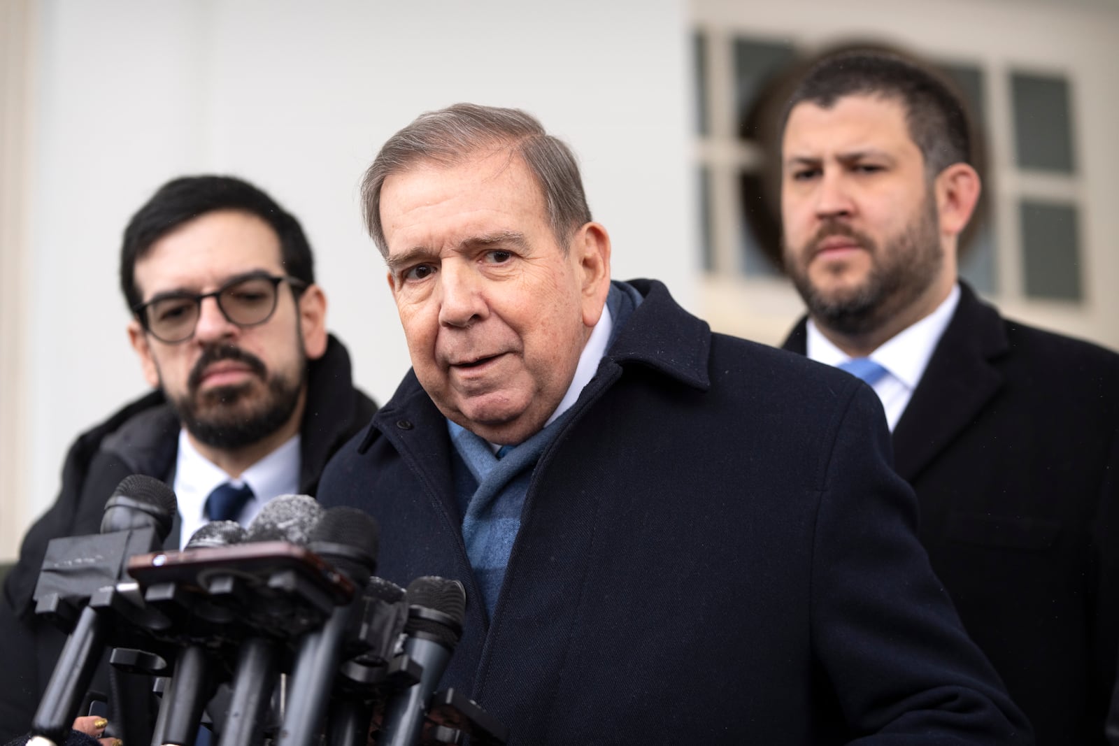 Venezuela's opposition leader Edmundo Gonzalez, center, speaks with reporters at the White House, Monday, Jan. 6, 2025, in Washington. (AP Photo/Mark Schiefelbein)