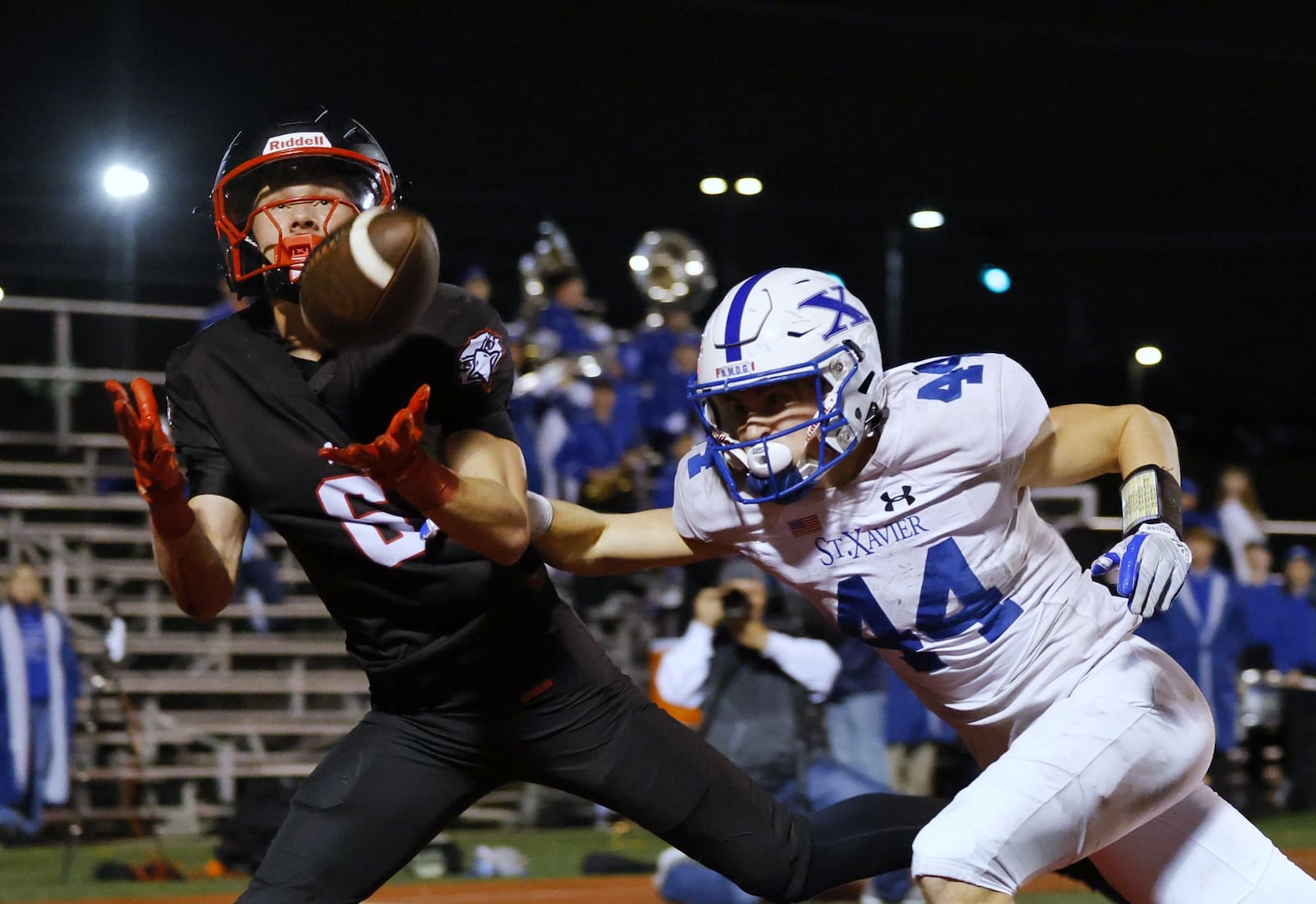 Lakota West's Finn Mason intercepts a pass intended for St. Xavier's Jake Britt during their Division 1 playoff football game Friday, Nov. 15, 2024 at Princeton's Mancuso Field in Sharonville. St. Xavier won 16-13 to advance. NICK GRAHAM/STAFF