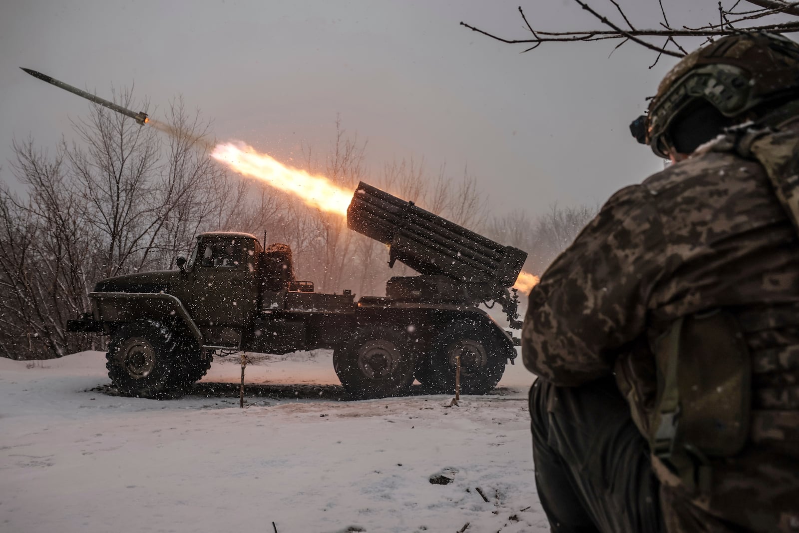 In this photo provided by Ukraine's 24th Mechanised Brigade press service, Ukrainian servicemen fire an MRLS BM-21 'Grad' towards Russian army positions near Chasiv Yar, Donetsk region, Ukraine, Saturday, Feb. 15, 2025. (Oleg Petrasiuk/Ukraine's 24th Mechanised Brigade via AP)