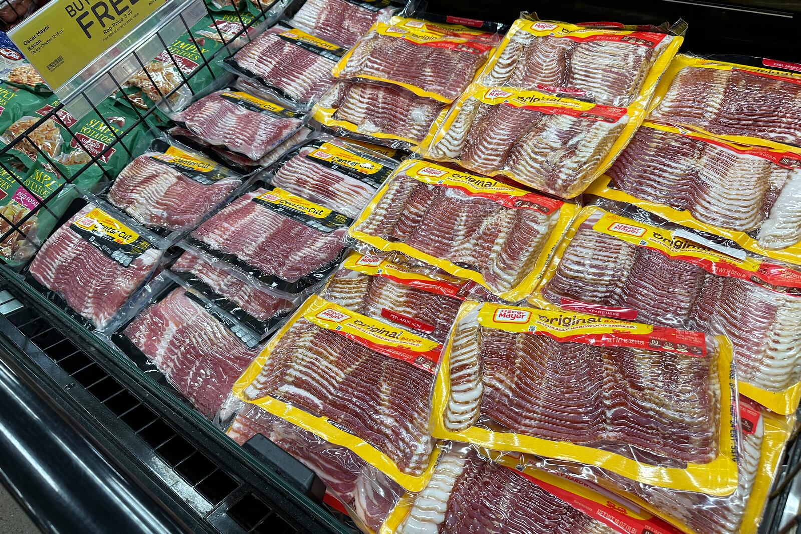 Oscar Mayer bacon packages are on display in a refrigerated case in a King Soopers grocery store Monday, Oct. 7, 2024, in southeast Denver. (AP Photo/David Zalubowski)