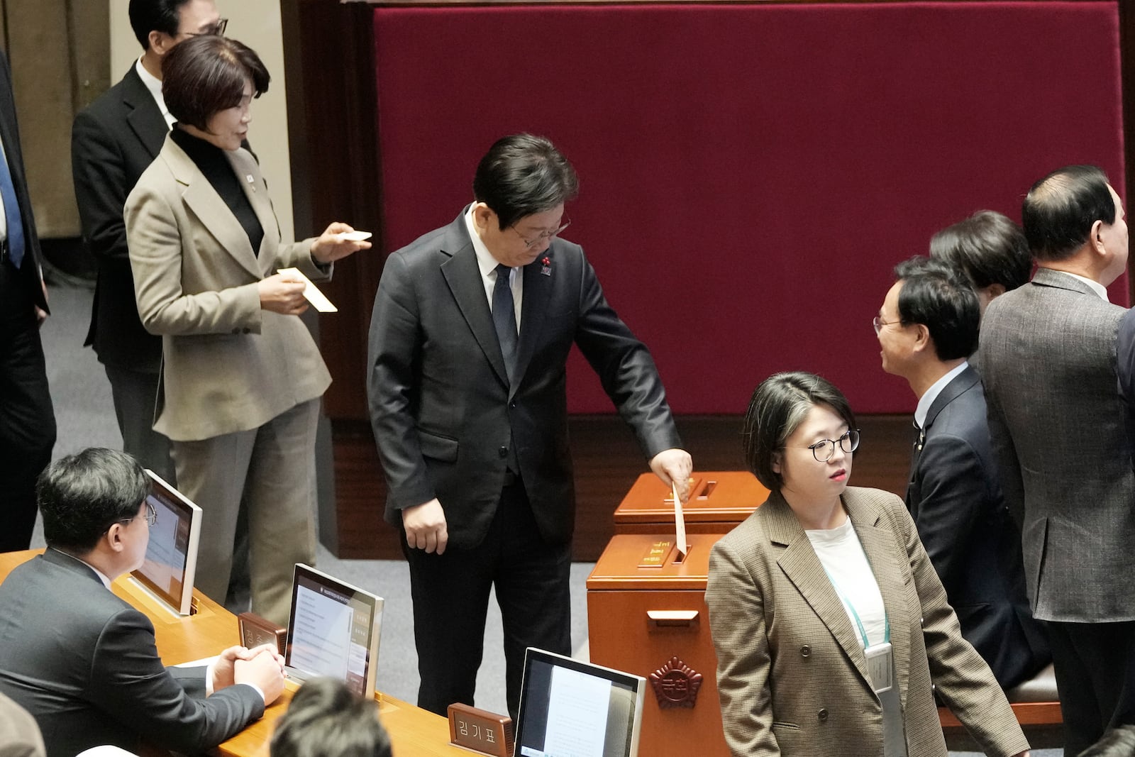 South Korea's opposition Democratic Party leader Lee Jae-myung casts his ballot during a plenary session for the impeachment motion against South Korean acting President Han Duck-soo at the National Assembly in Seoul, South Korea, Friday Dec. 27, 2024. (AP Photo/Ahn Young-joon)