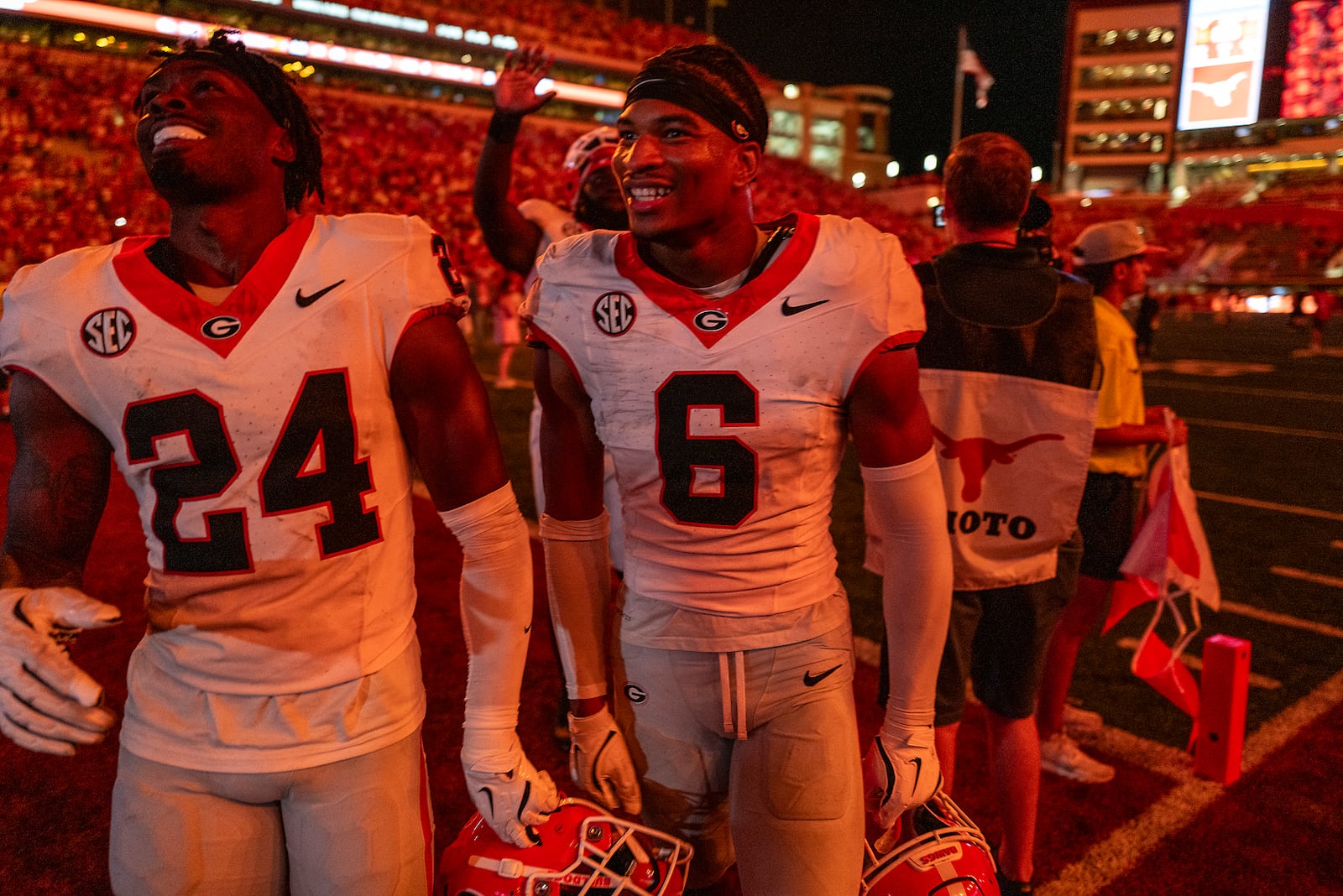 Georgia defensive backs Malaki Starks (24) and Daylen Everette (6) celebrate as they leave the field after Georgia defeated Texas during an NCAA college football game in Austin, Texas, Saturday, Oct. 19, 2024. (AP Photo/Rodolfo Gonzalez)