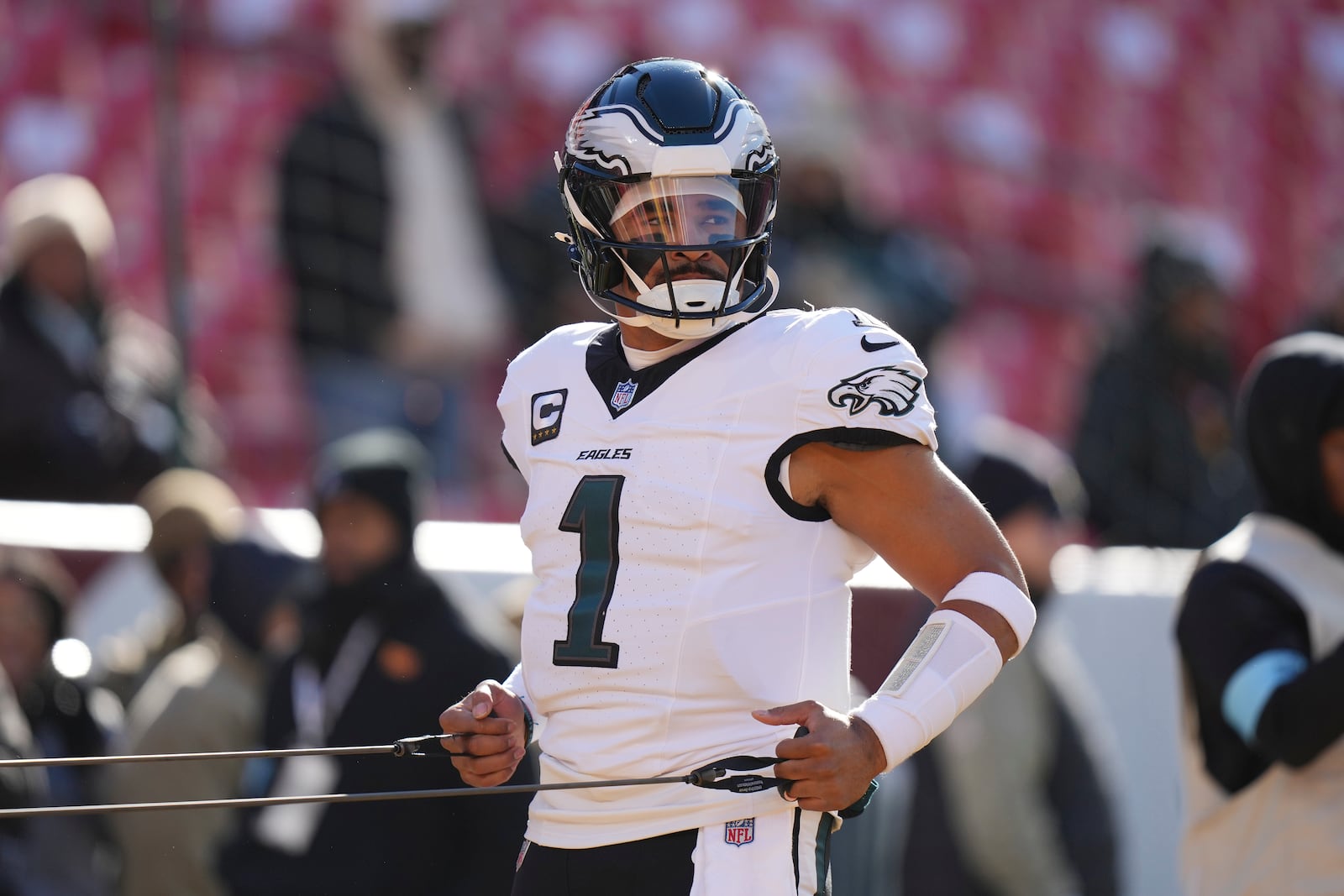 Philadelphia Eagles quarterback Jalen Hurts (1) warming up before the start of an NFL football game, Sunday, Dec. 22, 2024, in Landover, Md. (AP Photo/Stephanie Scarbrough)