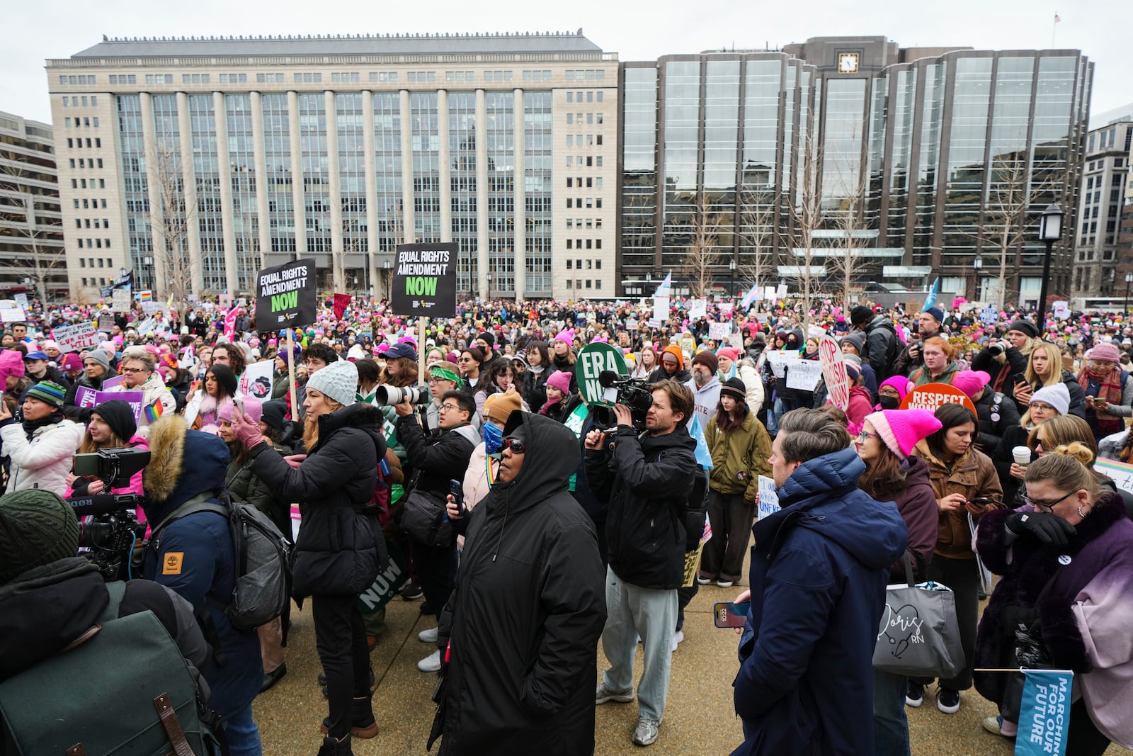 A group gathers at Franklin Park before the People's March, Saturday, Jan. 18, 2025, in Washington. (AP Photo/Julio Cortez)