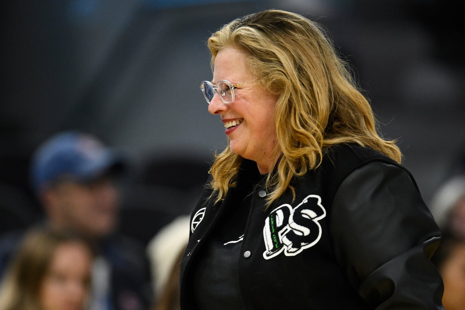 UCLA Bruins head coach Cori Close smiles against the Creighton Bluejays during the second half of an NCAA college basketball game Friday, Dec. 20, 2024, in San Francisco. (AP Photo/Eakin Howard)