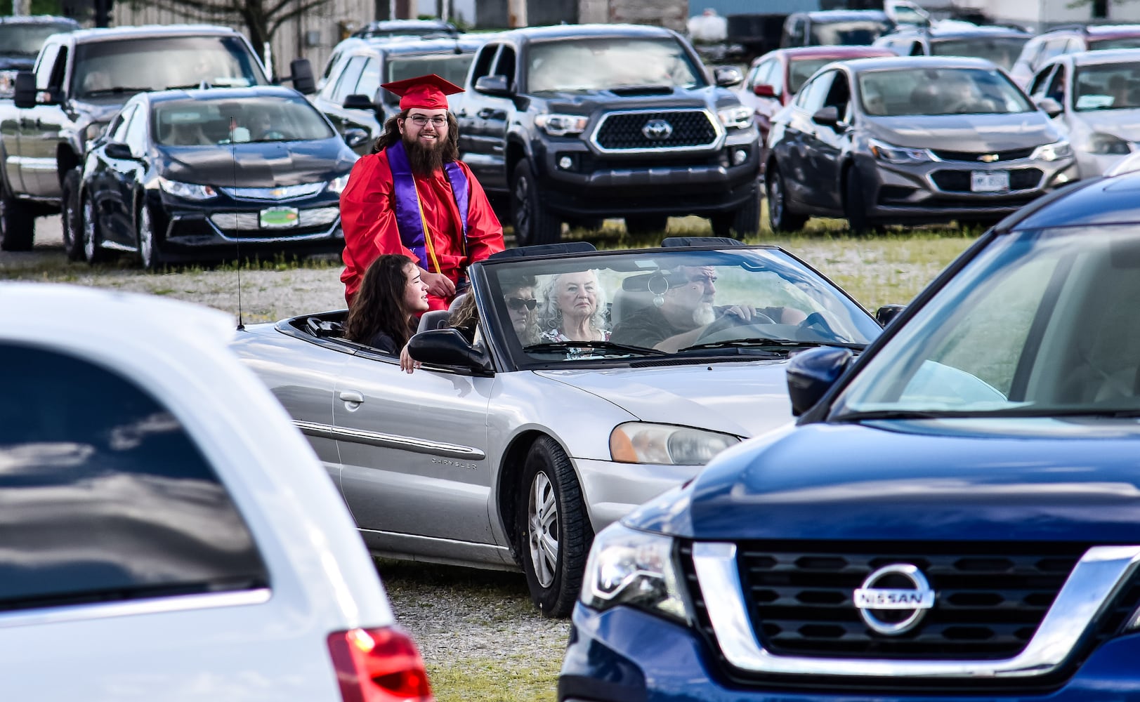 Madison High School drive-thru graduation ceremony at Land of Illusion