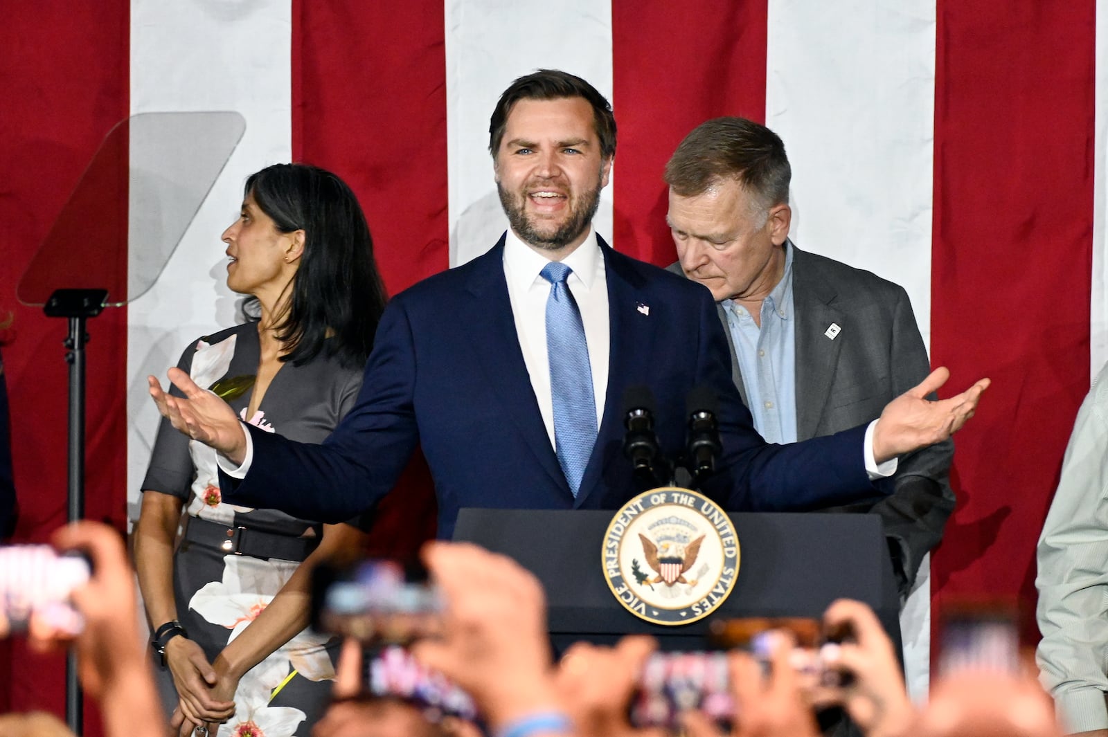 Vice President JD Vance, center, speaks at a rally about "America's industrial resurgence," Friday, March 14, 2025, at Vantage Plastics in Bay City, Mich. (AP Photo/Jose Juarez)