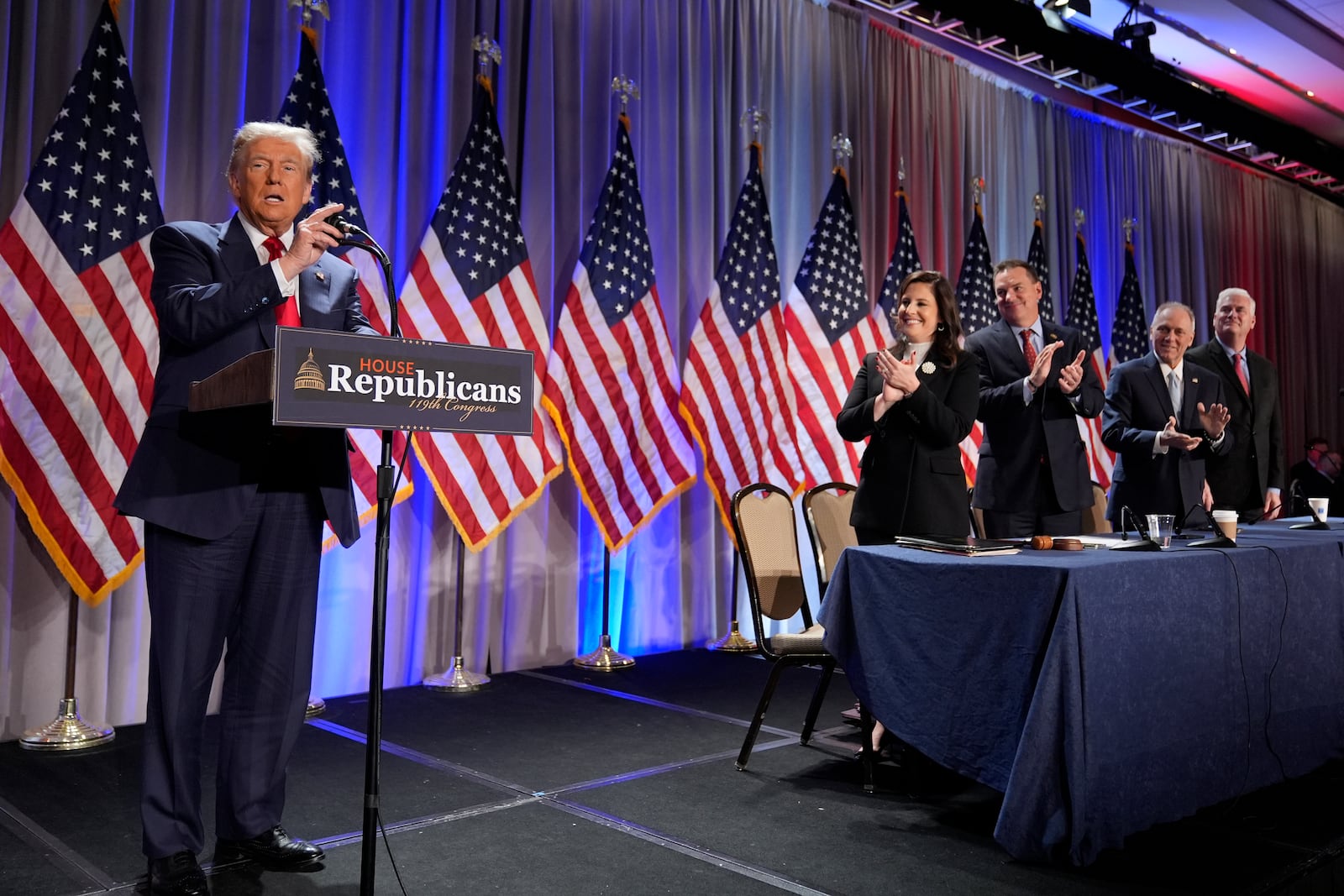 President-elect Donald Trump speaks as he arrives for a meeting with the House GOP conference, Wednesday, Nov. 13, 2024, in Washington. From left are Rep. Elise Stefanik, R-N.Y., Rep. Richard Hudson, R-N.C., Rep. Steve Scalise, R-La., and Rep. Tom Emmer, R-Minn. AP Photo/Alex Brandon)