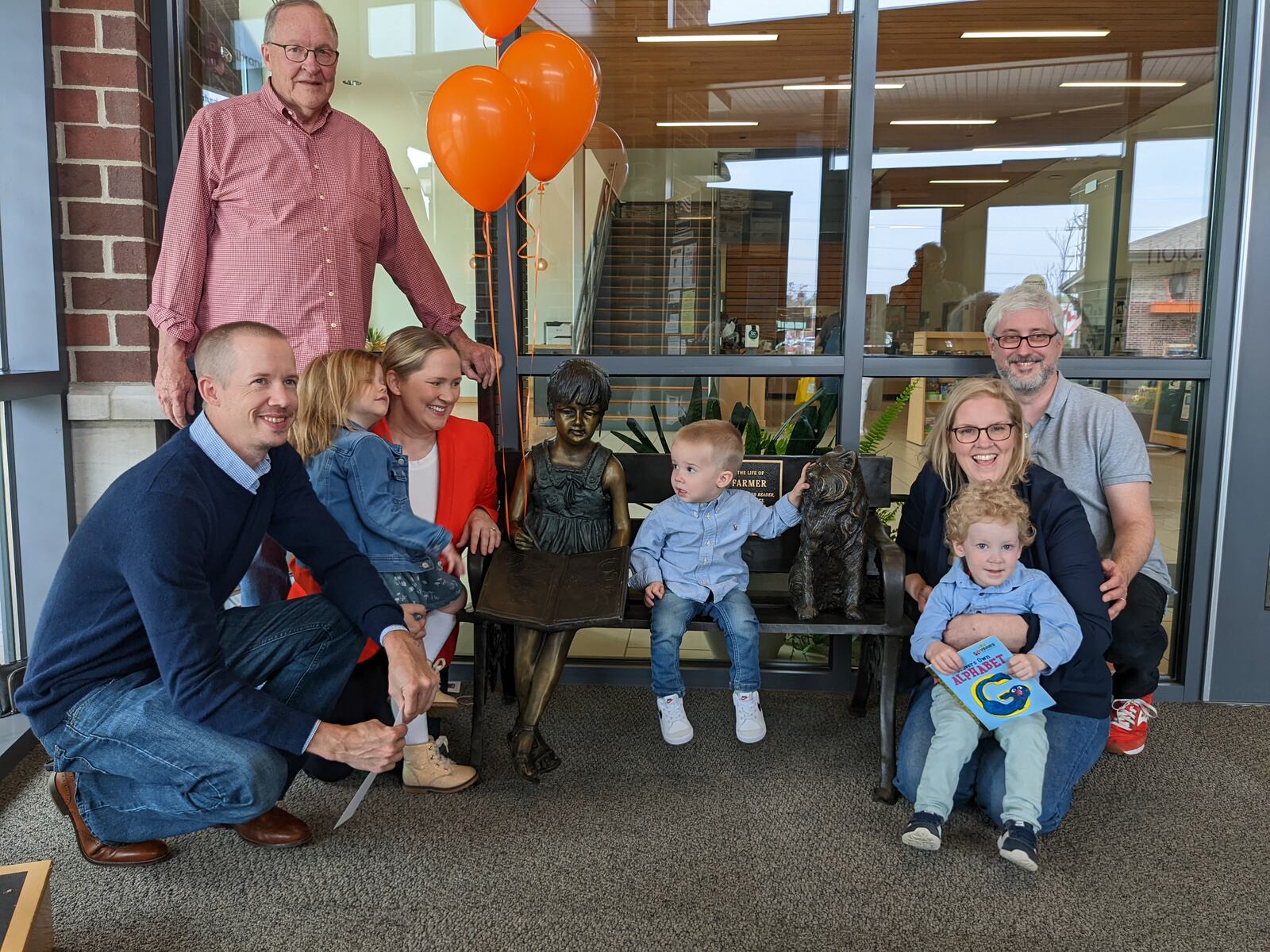 Family members of the late Shari Farmer gathered for the dedication of a bench at the Oxford Lane Library last Sunday placed in the vestibule in her memory. CONTRIBUTED