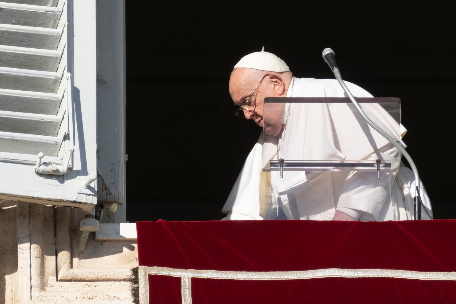 Pope Francis leaves after he recited the Angelus noon prayer from the window of his studio overlooking St.Peter's Square, at the Vatican, Thursday, Dec. 26, 2024. (AP Photo/Andrew Medichini)