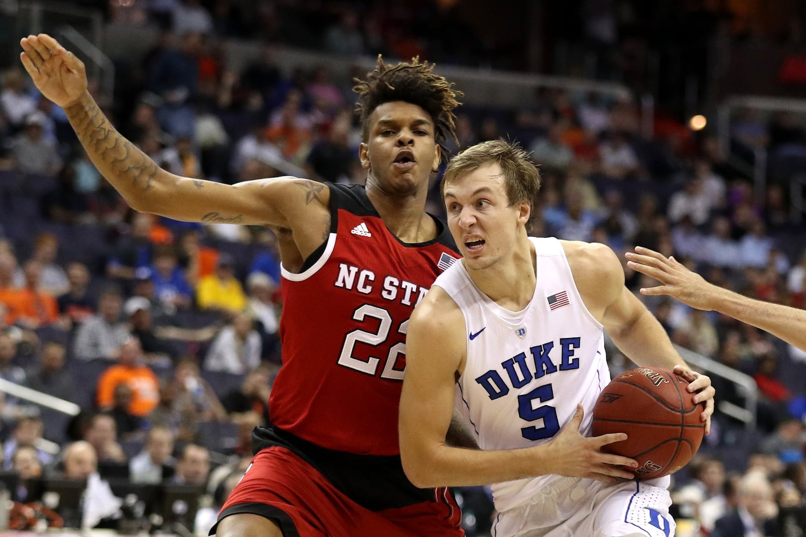 WASHINGTON, DC - MARCH 09: Luke Kennard #5 of the Duke Blue Devils dribbles in front of Shaun Kirk #22 of the North Carolina State Wolfpack during the first half in the second round of the 2016 ACC Basketball Tournament at Verizon Center on March 9, 2016 in Washington, DC. Pittsburgh Panthers won, 72-71. (Photo by Patrick Smith/Getty Images)