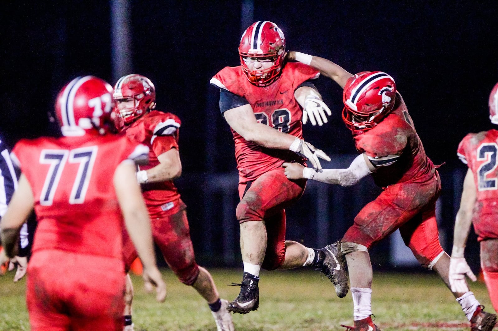 Madison’s Max Evans (38) cheers as he runs to the sideline after a defensive stop during their Division V, Region 20 playoff game against Portsmouth on Saturday night at Brandenburg Field in Madison Township. Madison won 26-0 NICK GRAHAM/STAFF