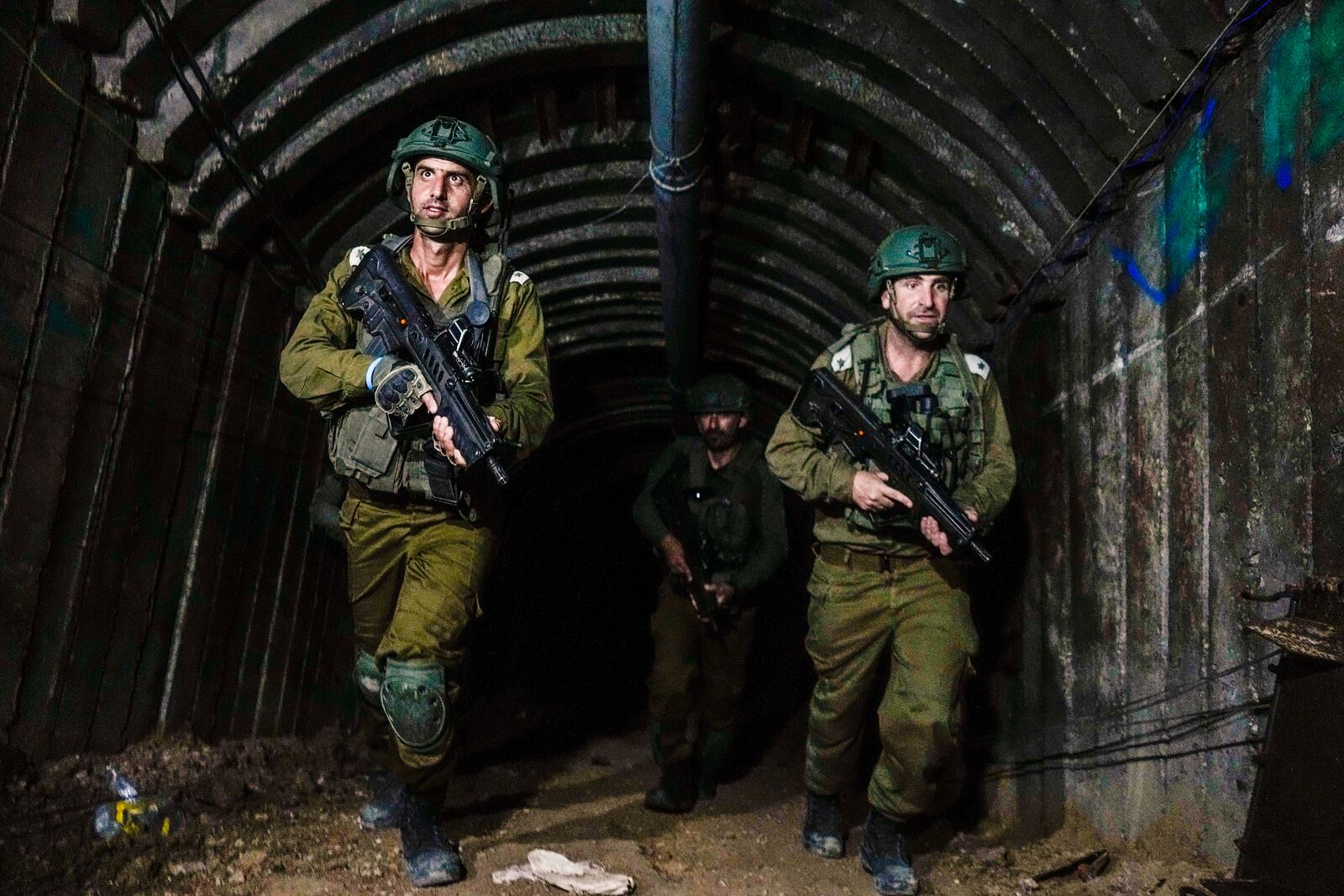 FILE - Israeli soldiers are seen in a tunnel that the military says Hamas militants used to attack the Erez crossing in the northern Gaza Strip, on Dec. 15, 2023. (AP Photo/Ariel Schalit, File)