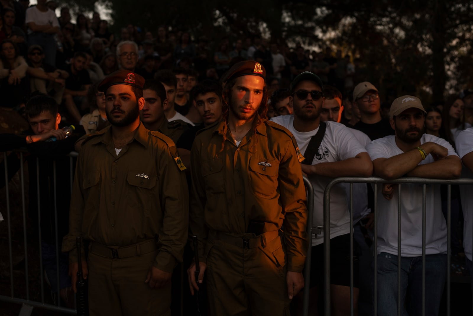 Mourners react during eulogies for Israeli soldier Capt. Itay Marcovich, who was killed in action in Lebanon, during his funeral in Kokhav Yair, Israel, Thursday, Nov. 14, 2024. (AP Photo/Ohad Zwigenberg)