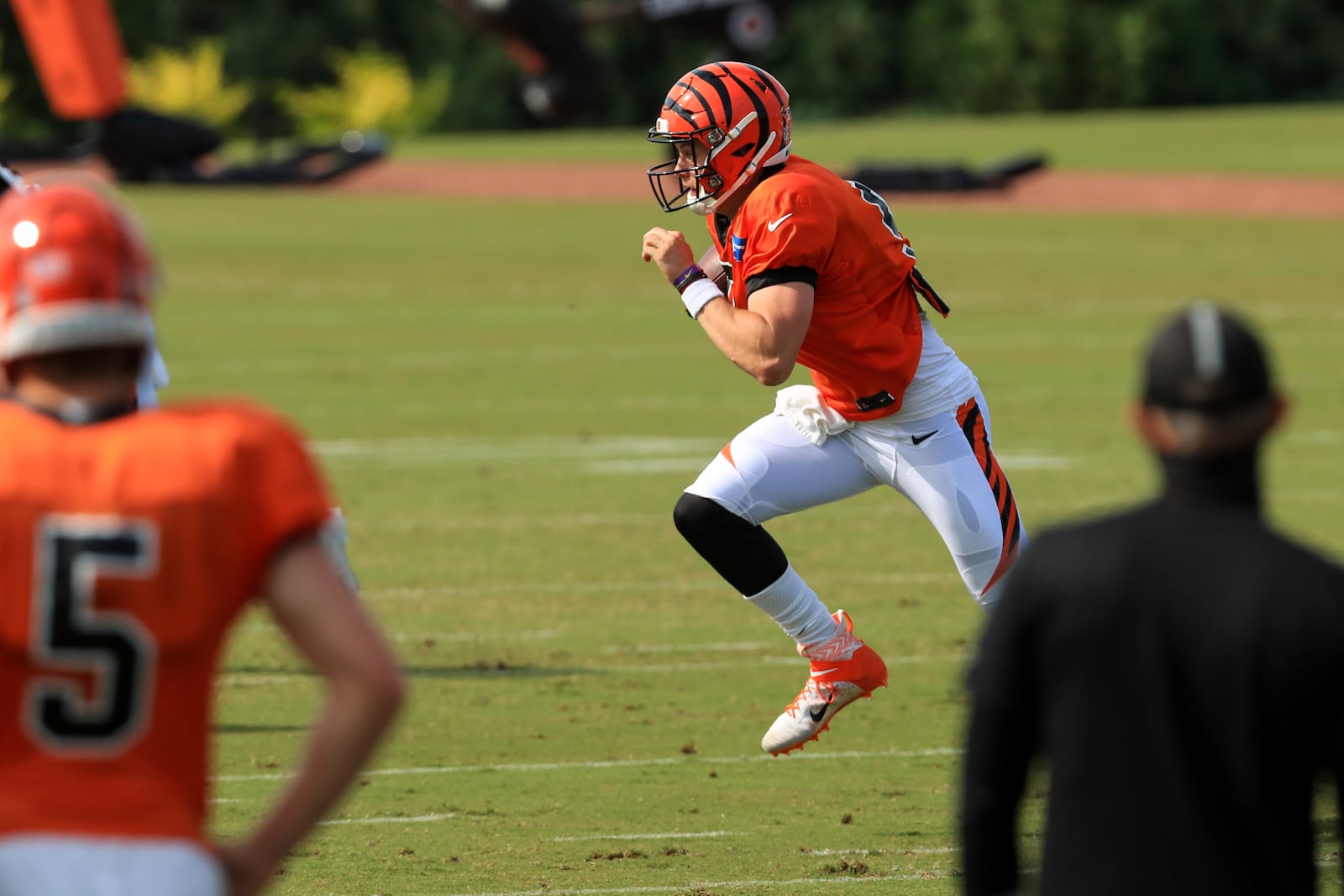 Cincinnati Bengals' Joe Burrow scrambles as he runs a drill during an NFL football camp practice in Cincinnati, Friday, Aug. 21, 2020. (AP Photo/Aaron Doster)